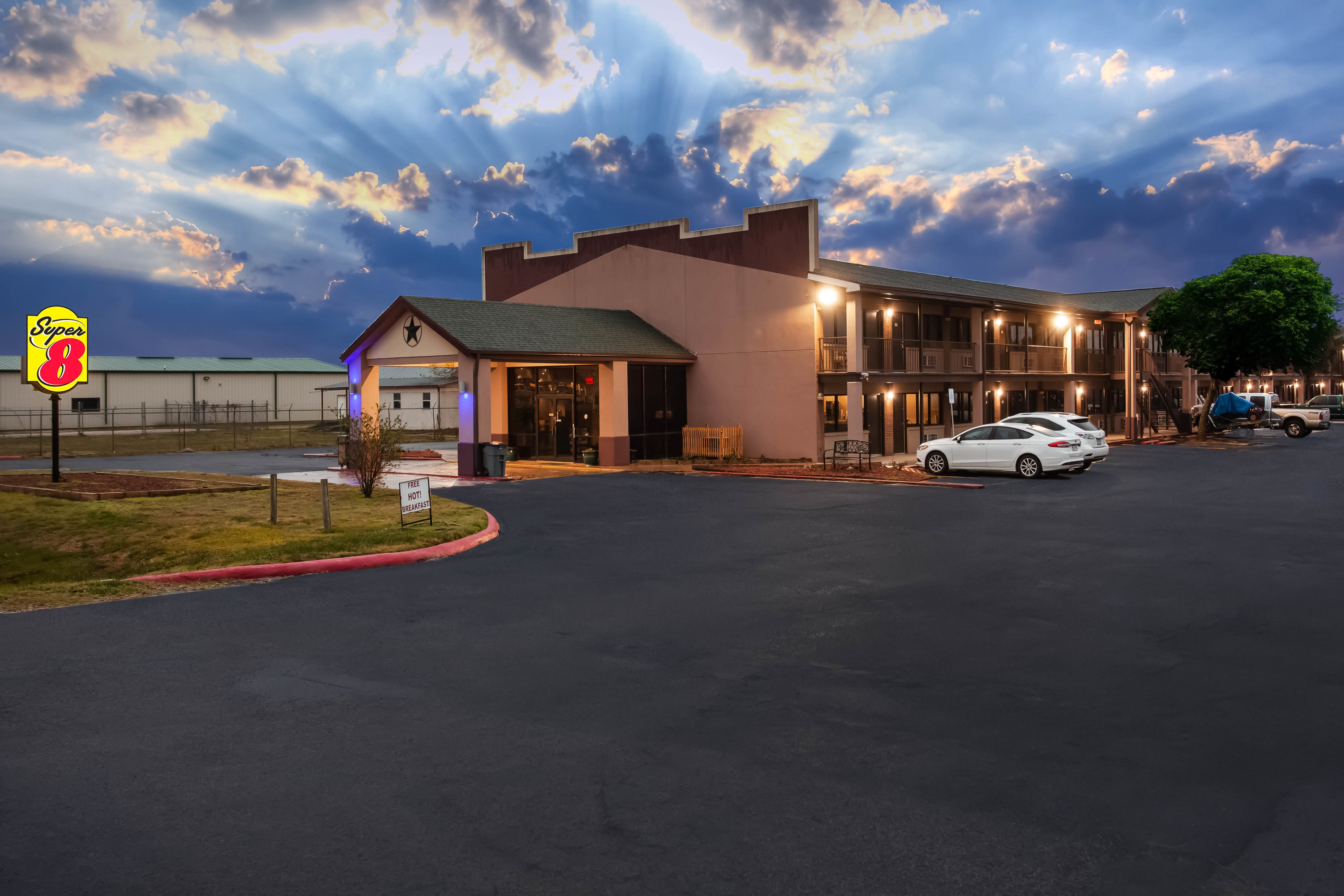 Exterior Dusk Image of Super 8 by Wyndham Giddings hotel in Giddings, Texas