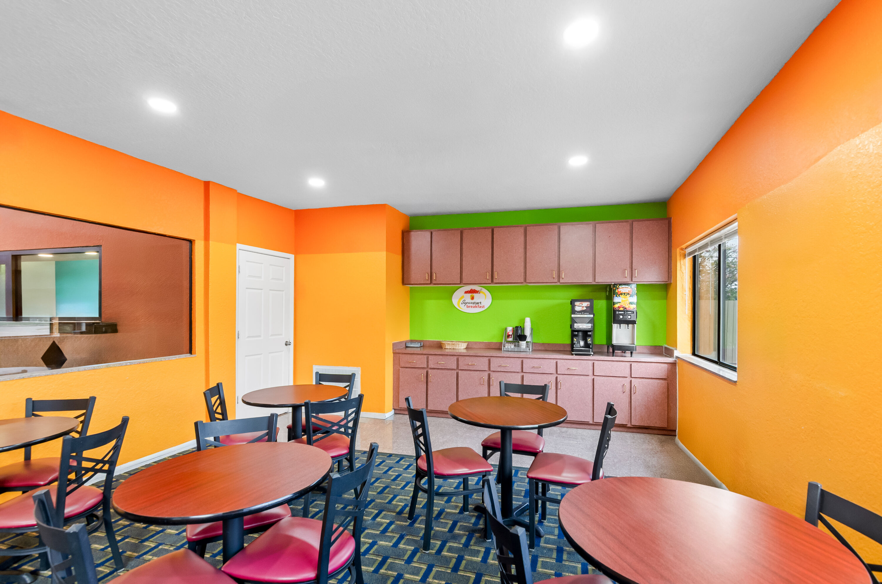 Super 8 by Wyndham Houston/Brookhollow NW restaurant breakfast area with seating in Houston, Texas