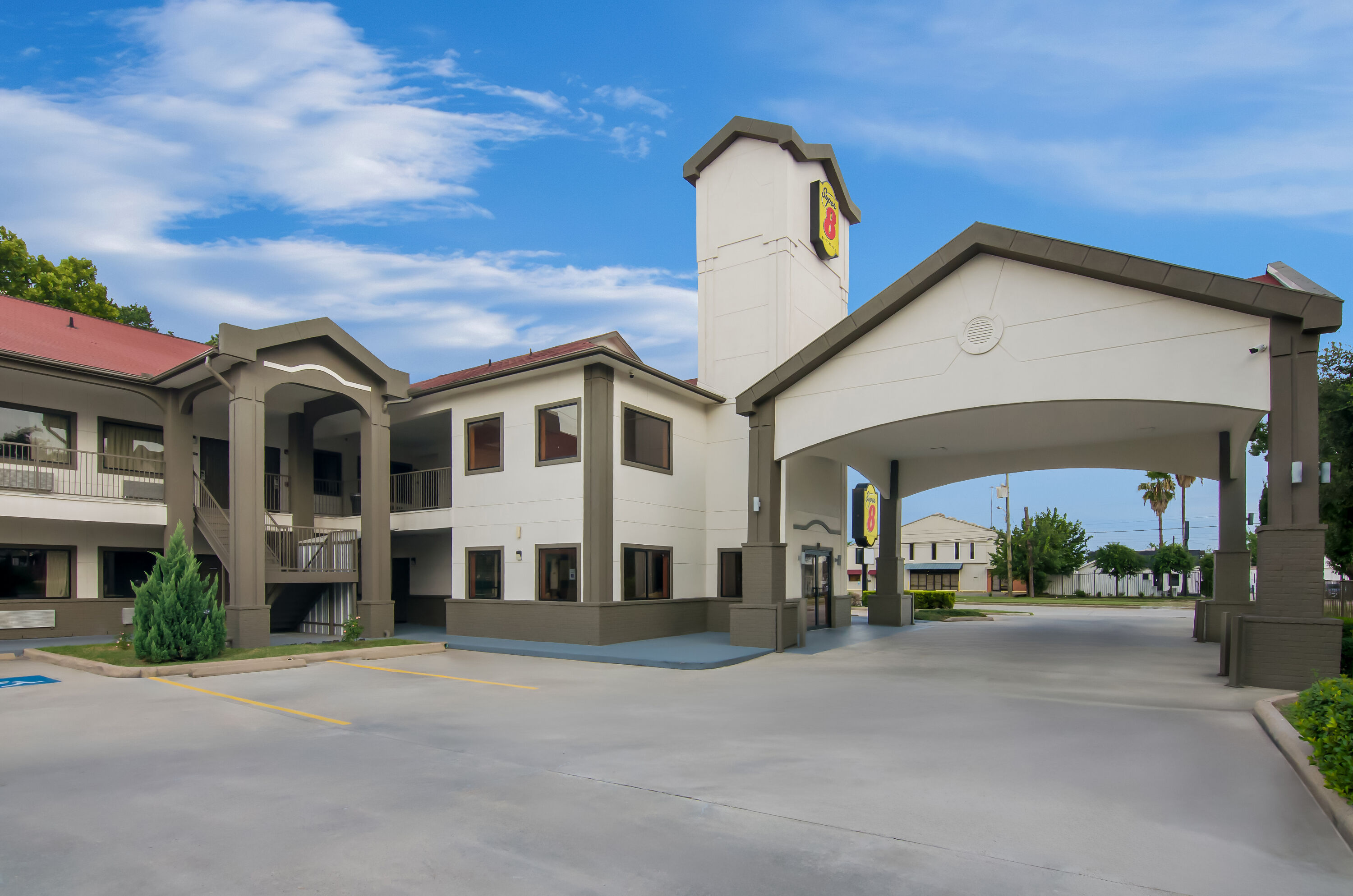 Exterior Day Image of Super 8 by Wyndham Houston/Brookhollow NW hotel in Houston, Texas