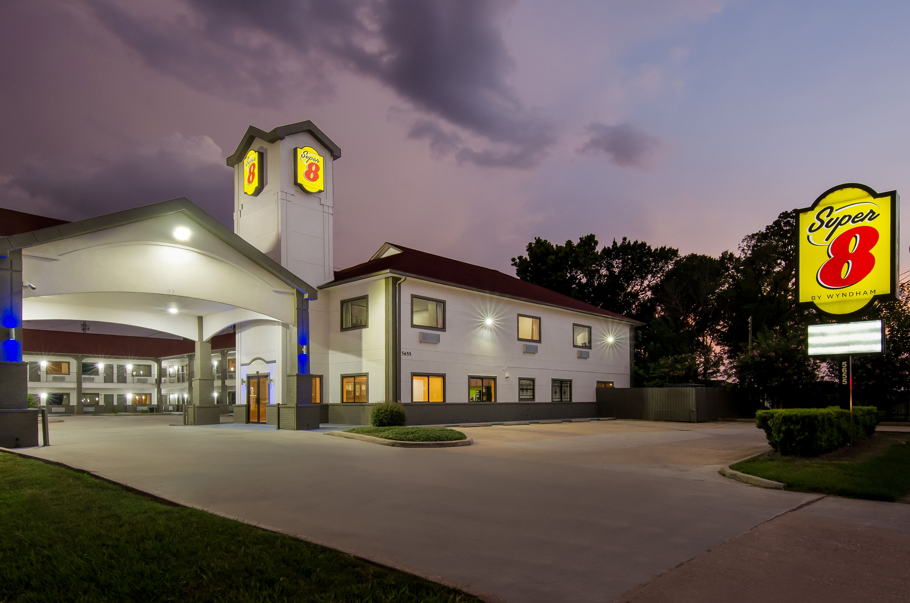 Exterior Night Image of Super 8 by Wyndham Houston/Brookhollow NW hotel in Houston, Texas