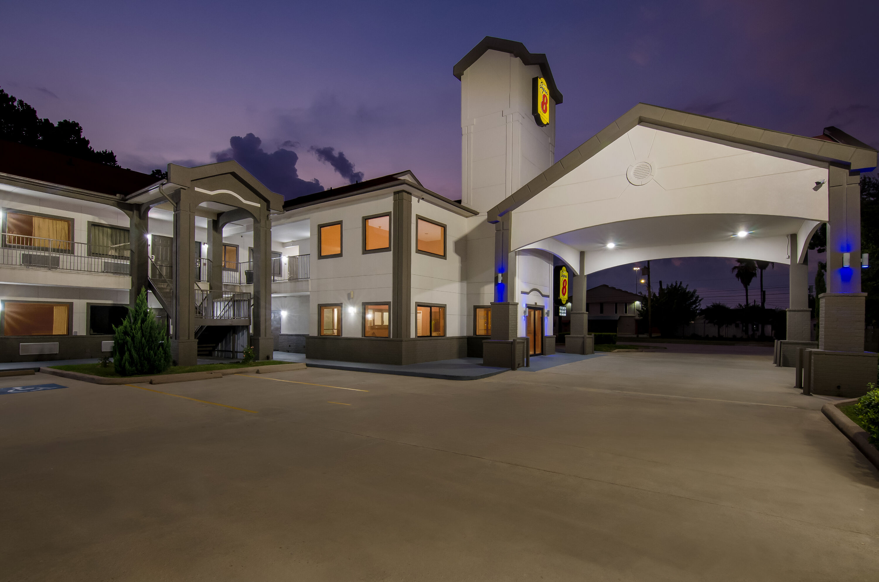 Exterior Night Image of Super 8 by Wyndham Houston/Brookhollow NW hotel in Houston, Texas