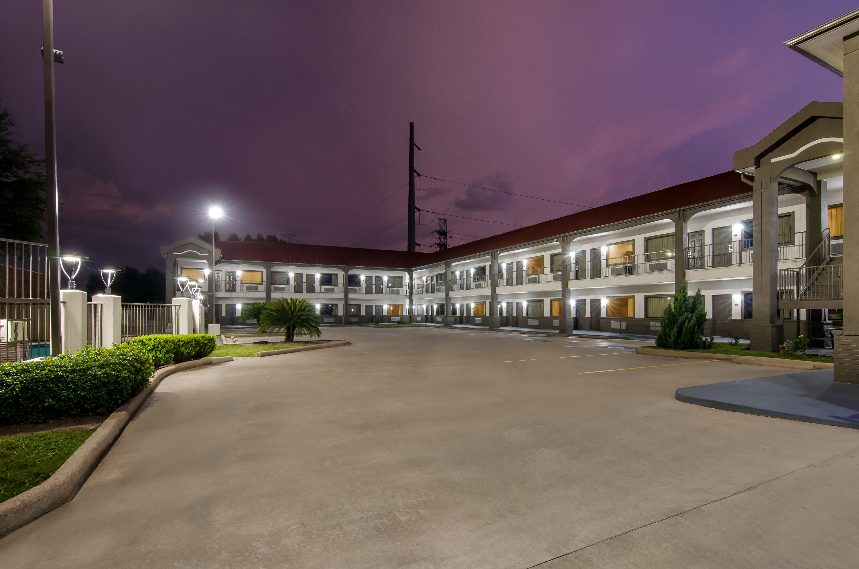 Exterior Night Image of Super 8 by Wyndham Houston/Brookhollow NW hotel in Houston, Texas