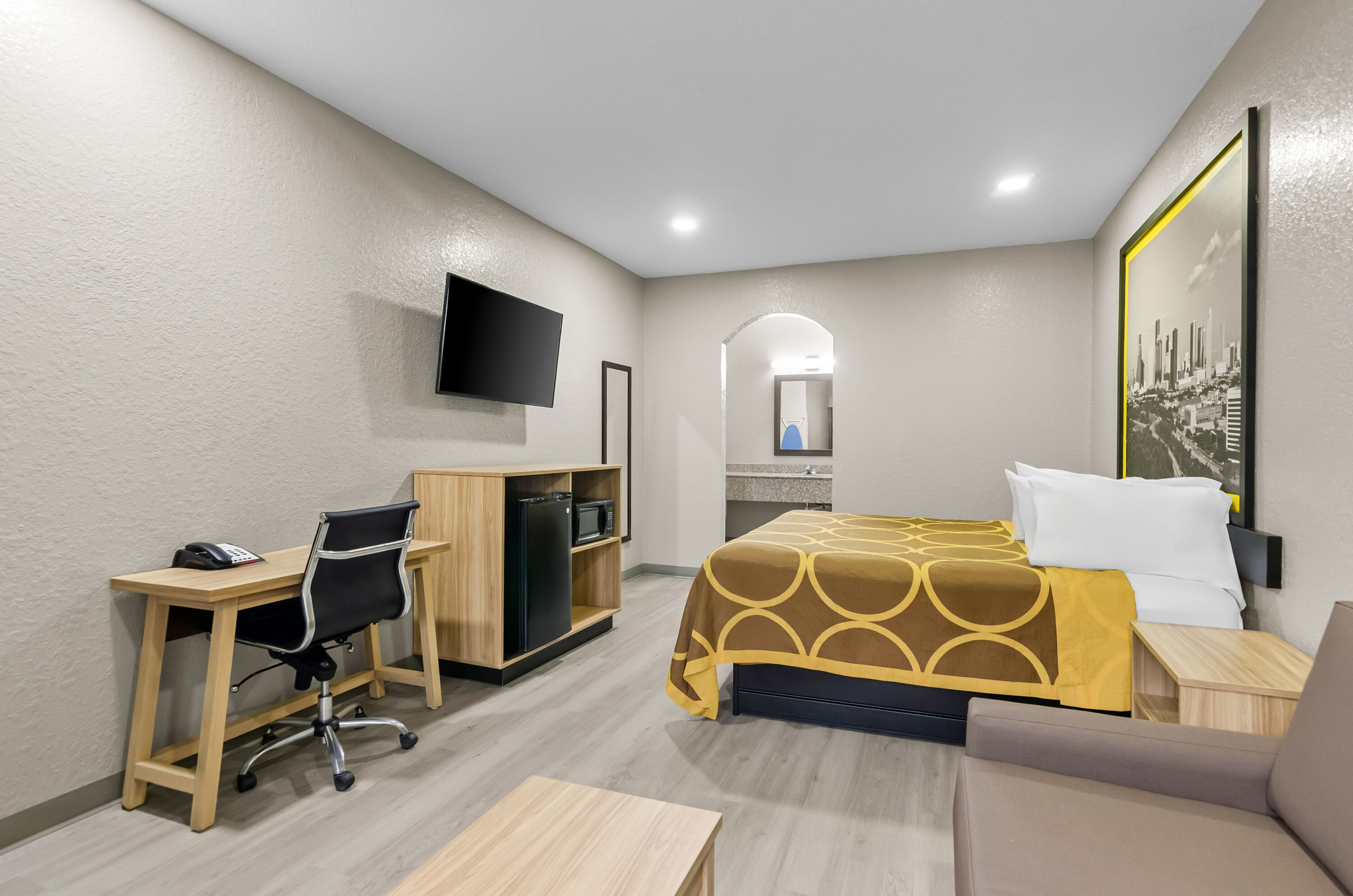 King bed guest room at the Super 8 by Wyndham Houston/Brookhollow NW in Houston, Texas