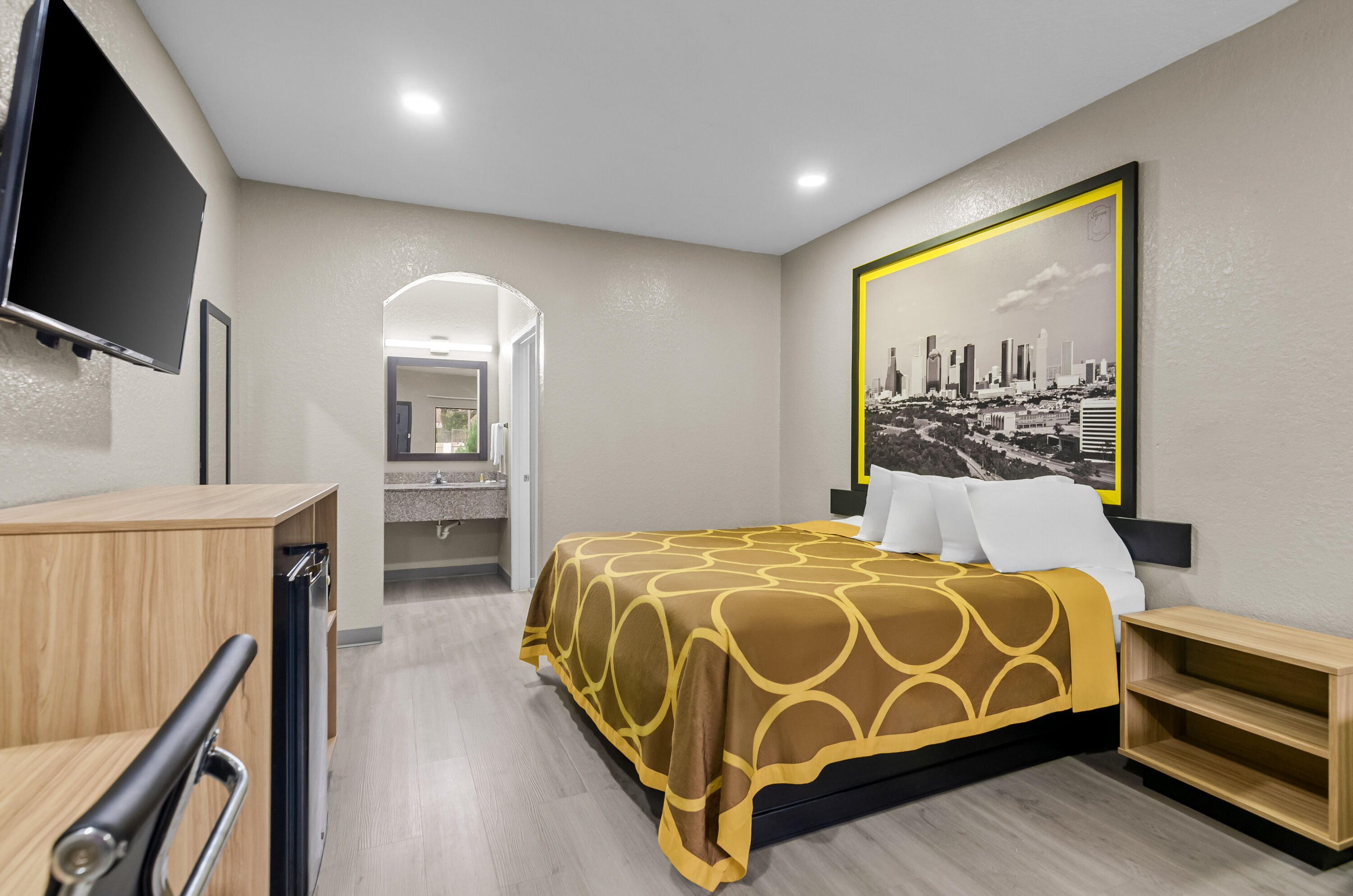 King bed guest room at the Super 8 by Wyndham Houston/Brookhollow NW in Houston, Texas