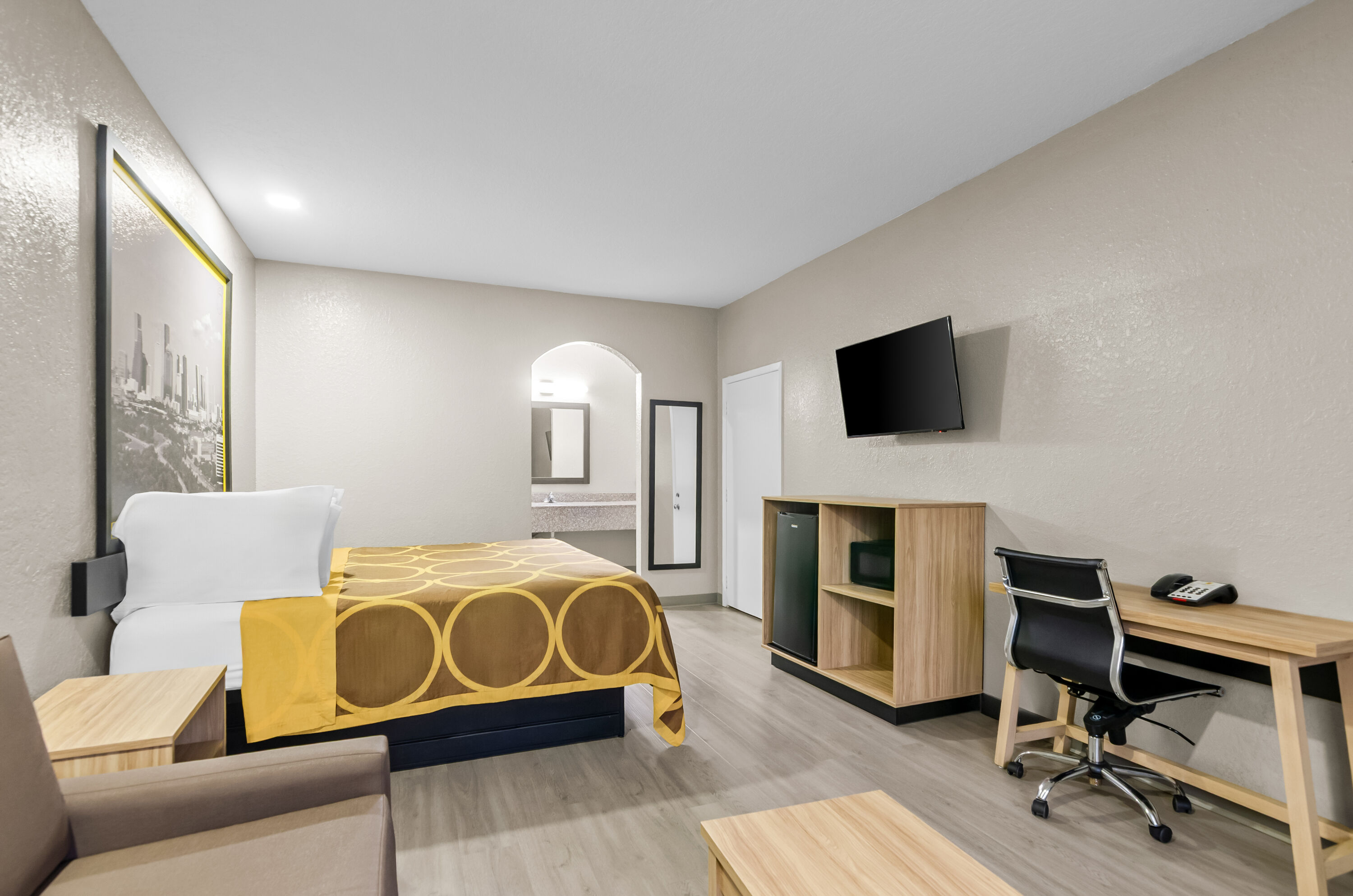 King bed guest room at the Super 8 by Wyndham Houston/Brookhollow NW in Houston, Texas