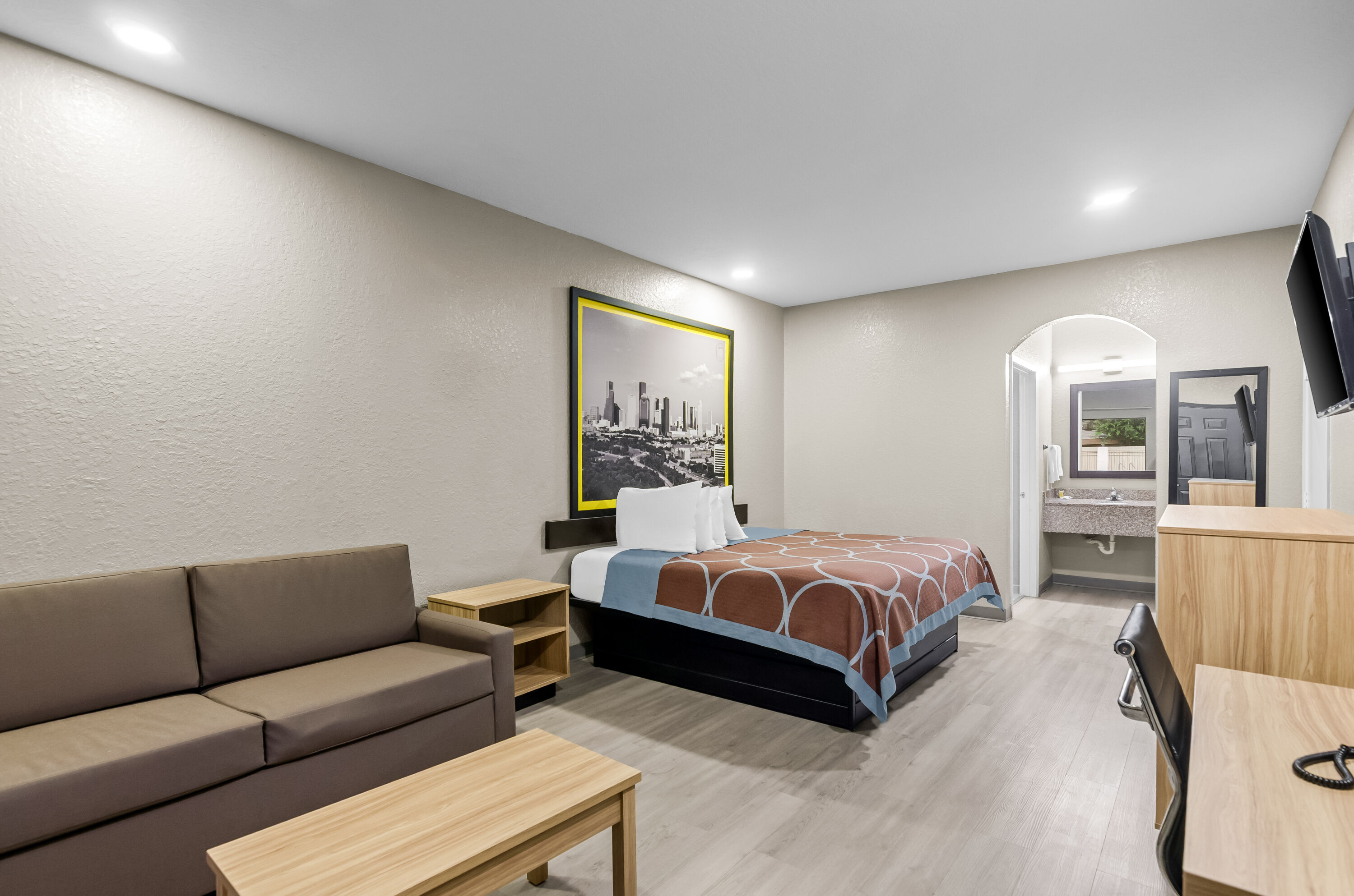King bed guest room at the Super 8 by Wyndham Houston/Brookhollow NW in Houston, Texas