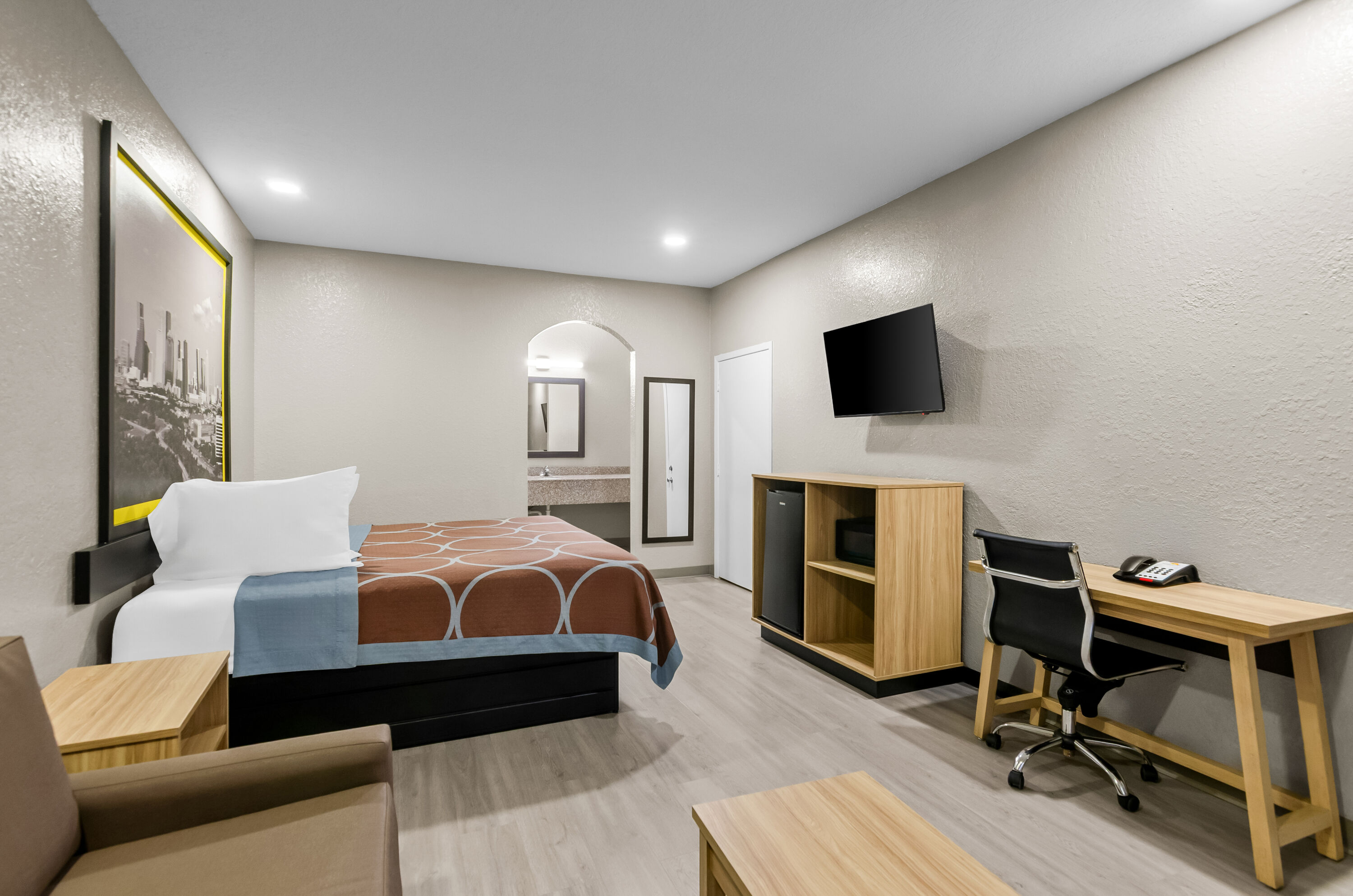 King bed guest room at the Super 8 by Wyndham Houston/Brookhollow NW in Houston, Texas