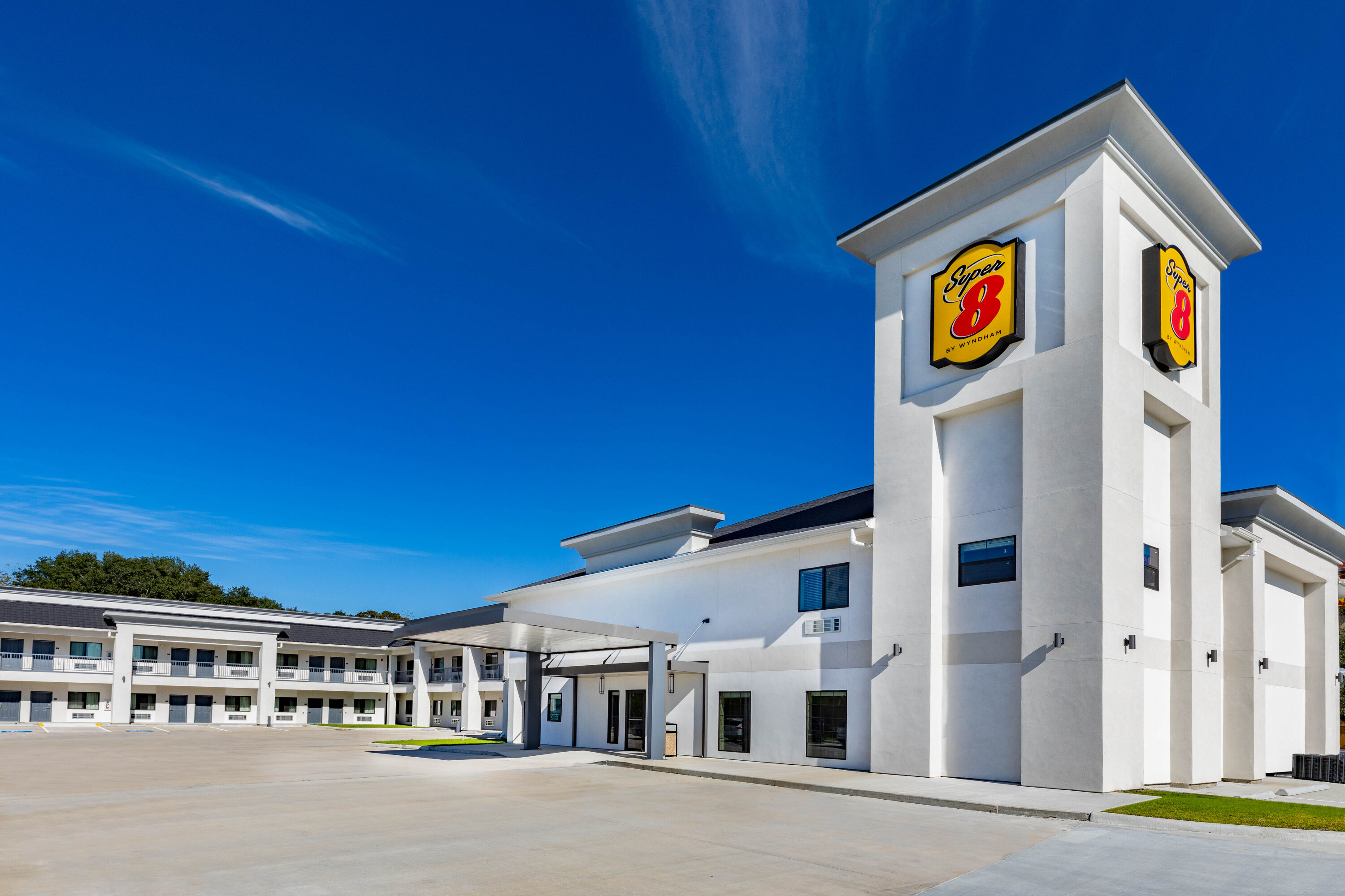 Exterior Day Image of Super 8 by Wyndham Houston NW Beltway 8/West Rd hotel in Houston, Texas