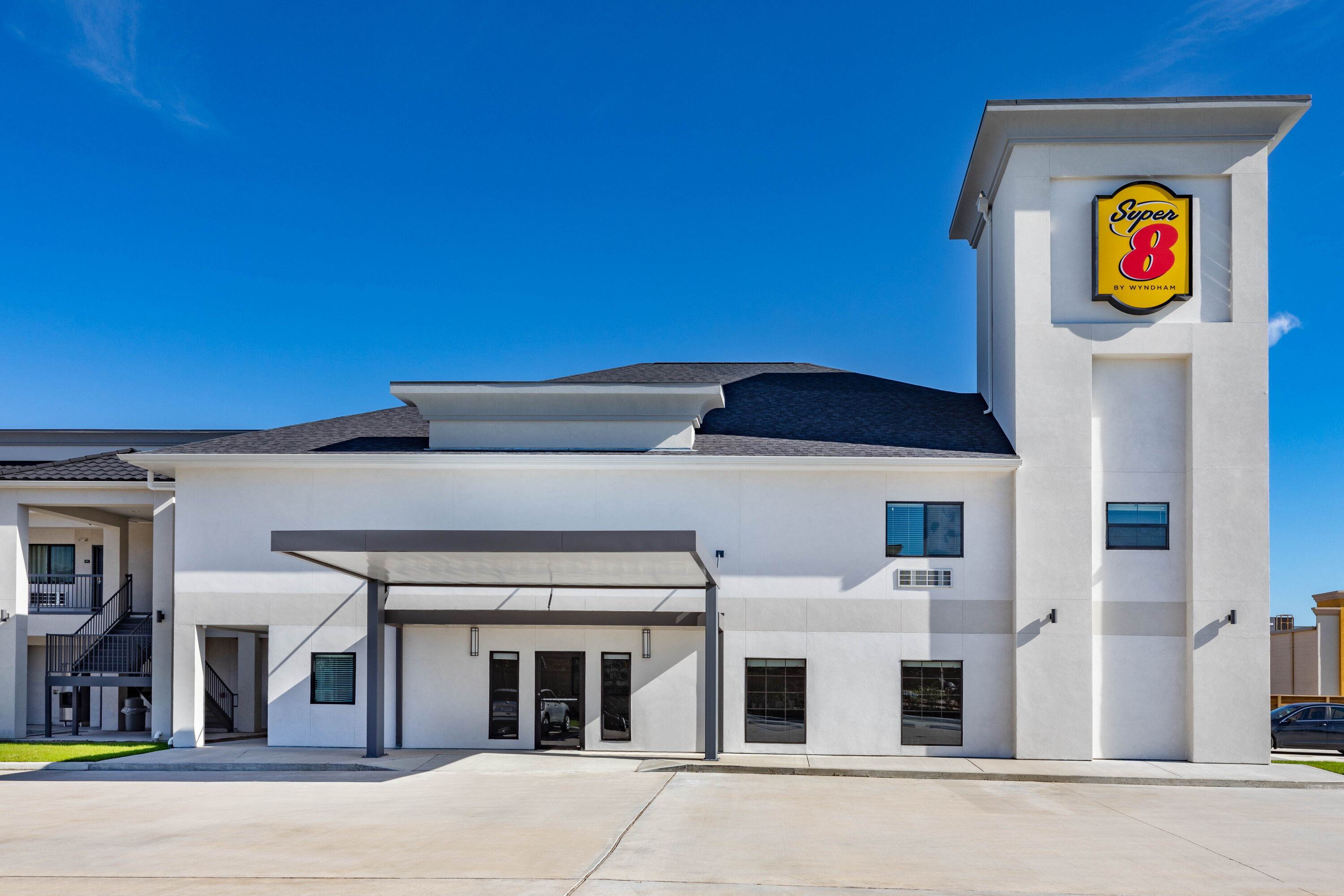 Exterior Day Image of Super 8 by Wyndham Houston NW Beltway 8/West Rd hotel in Houston, Texas