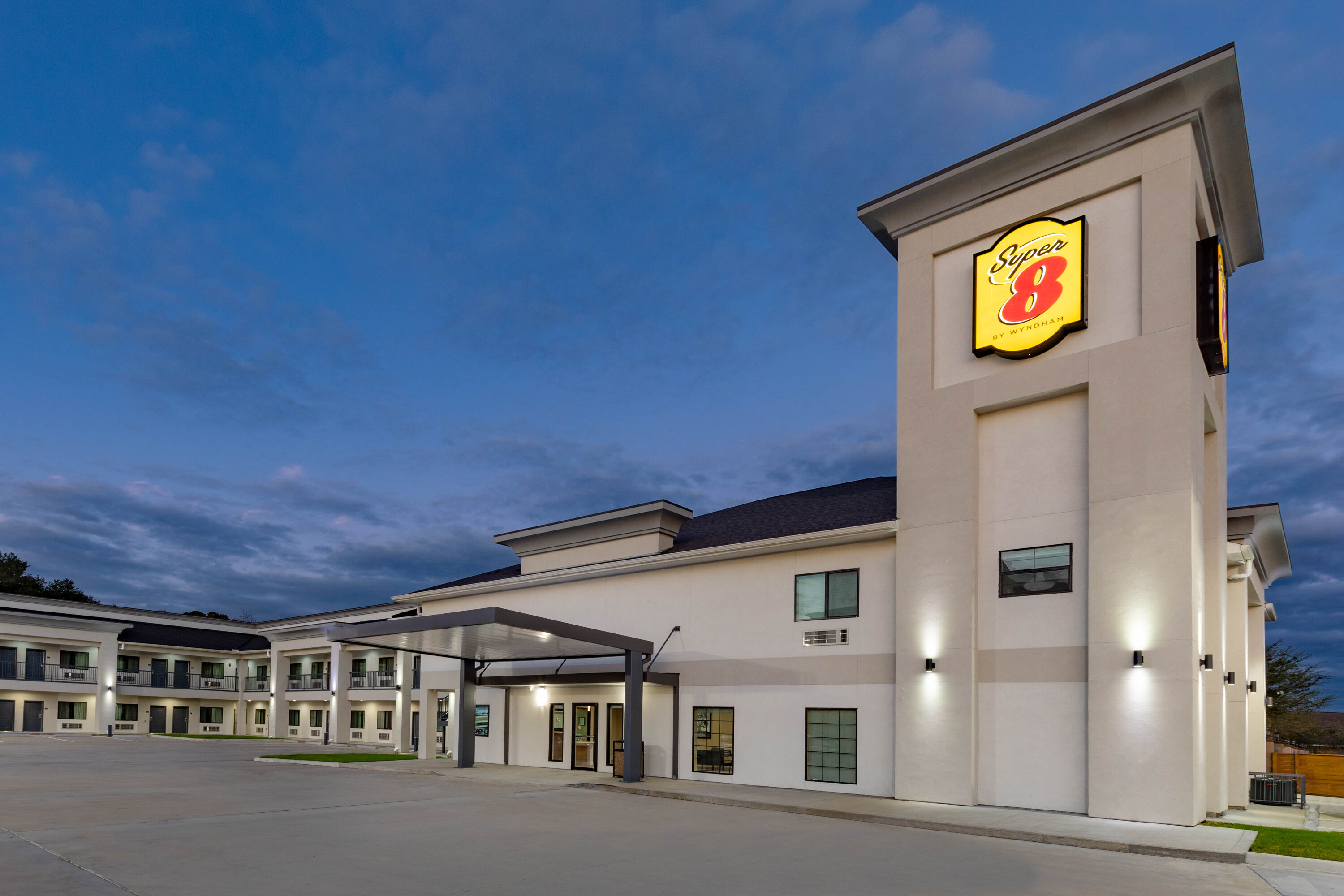 Exterior Dusk Image of Super 8 by Wyndham Houston NW Beltway 8/West Rd hotel in Houston, Texas