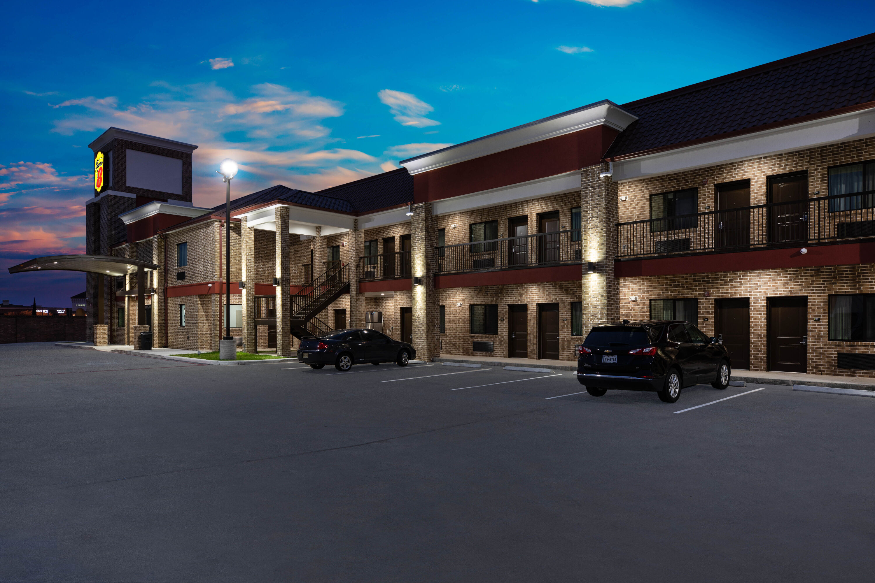 Exterior Night Image of Super 8 by Wyndham Humble/Fallcreek/Houston hotel in Humble, Texas