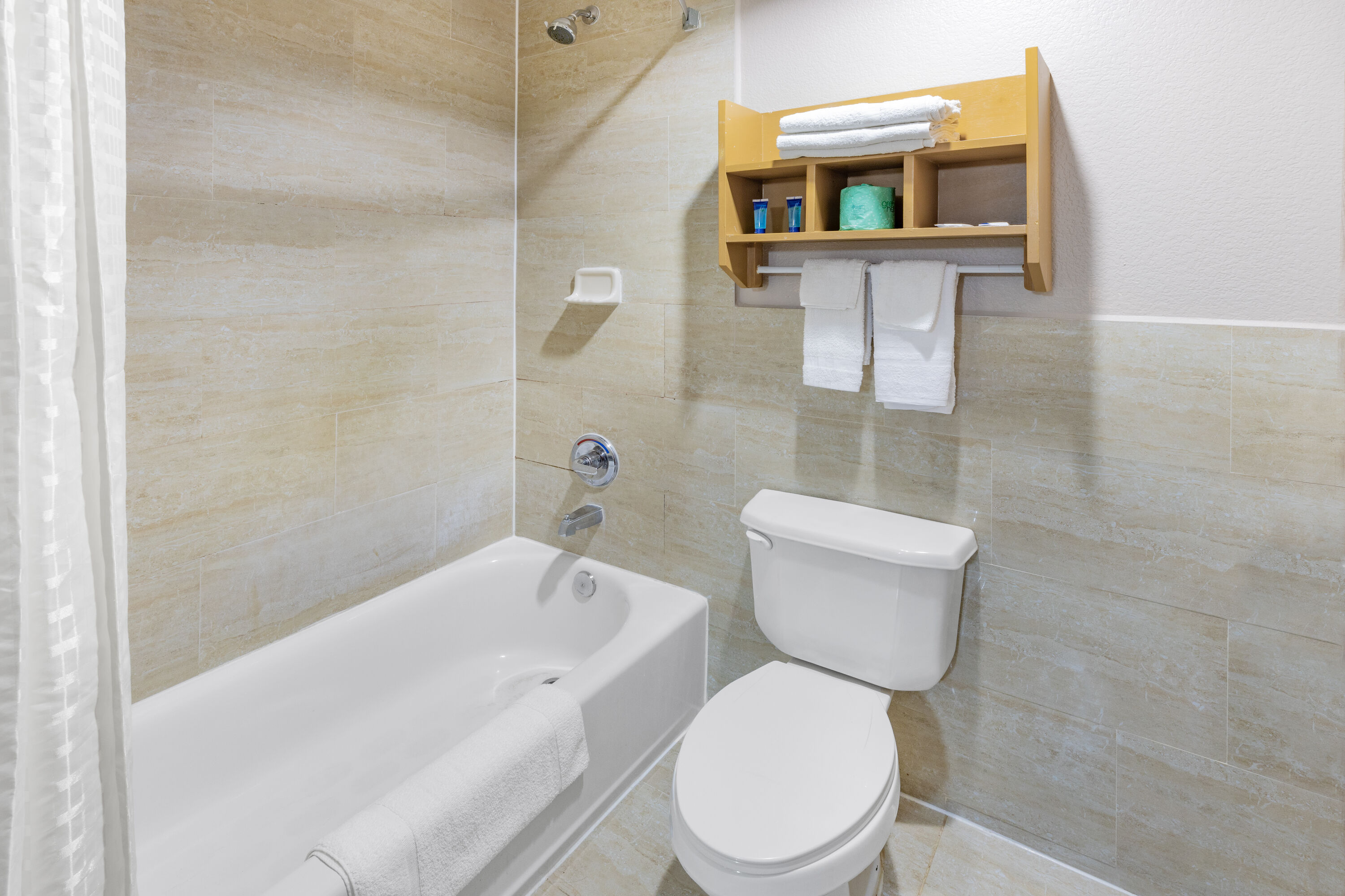 Guest room bath at the Super 8 by Wyndham League City/Kemah Area in League City, Texas