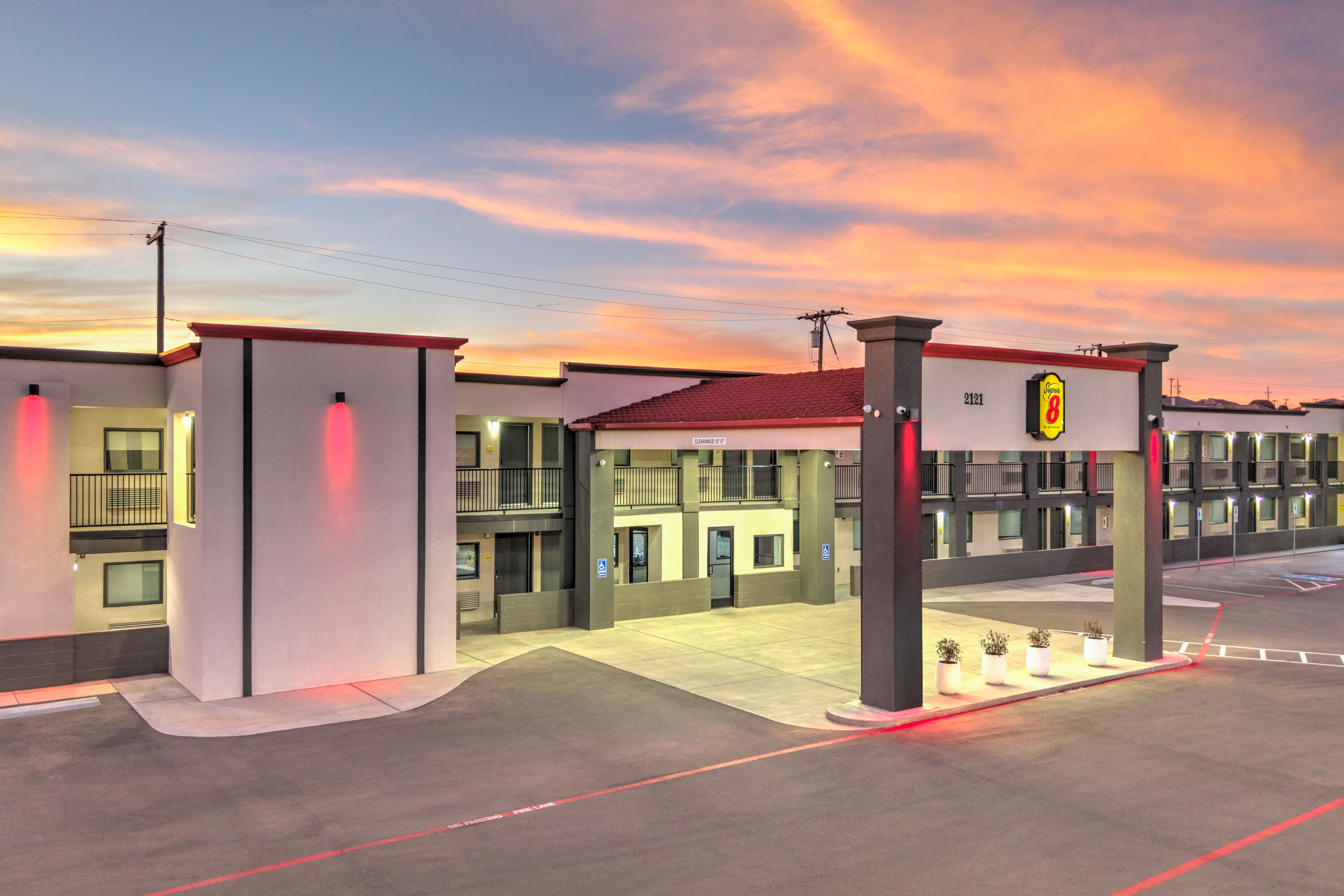 Exterior Dusk Image of Super 8 by Wyndham Lubbock Airport hotel in Lubbock, Texas