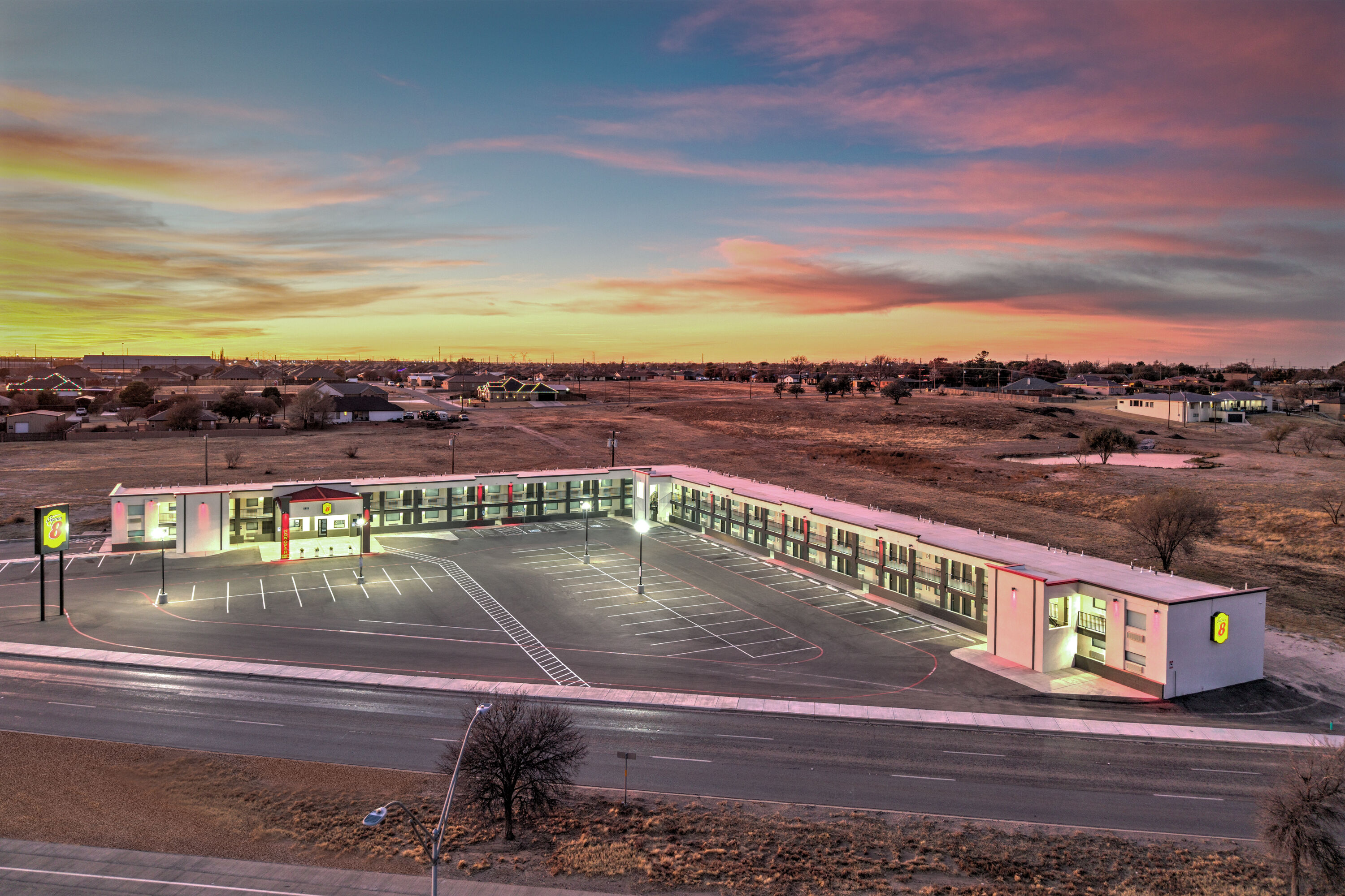 Exterior Dusk Image of Super 8 by Wyndham Lubbock Airport hotel in Lubbock, Texas