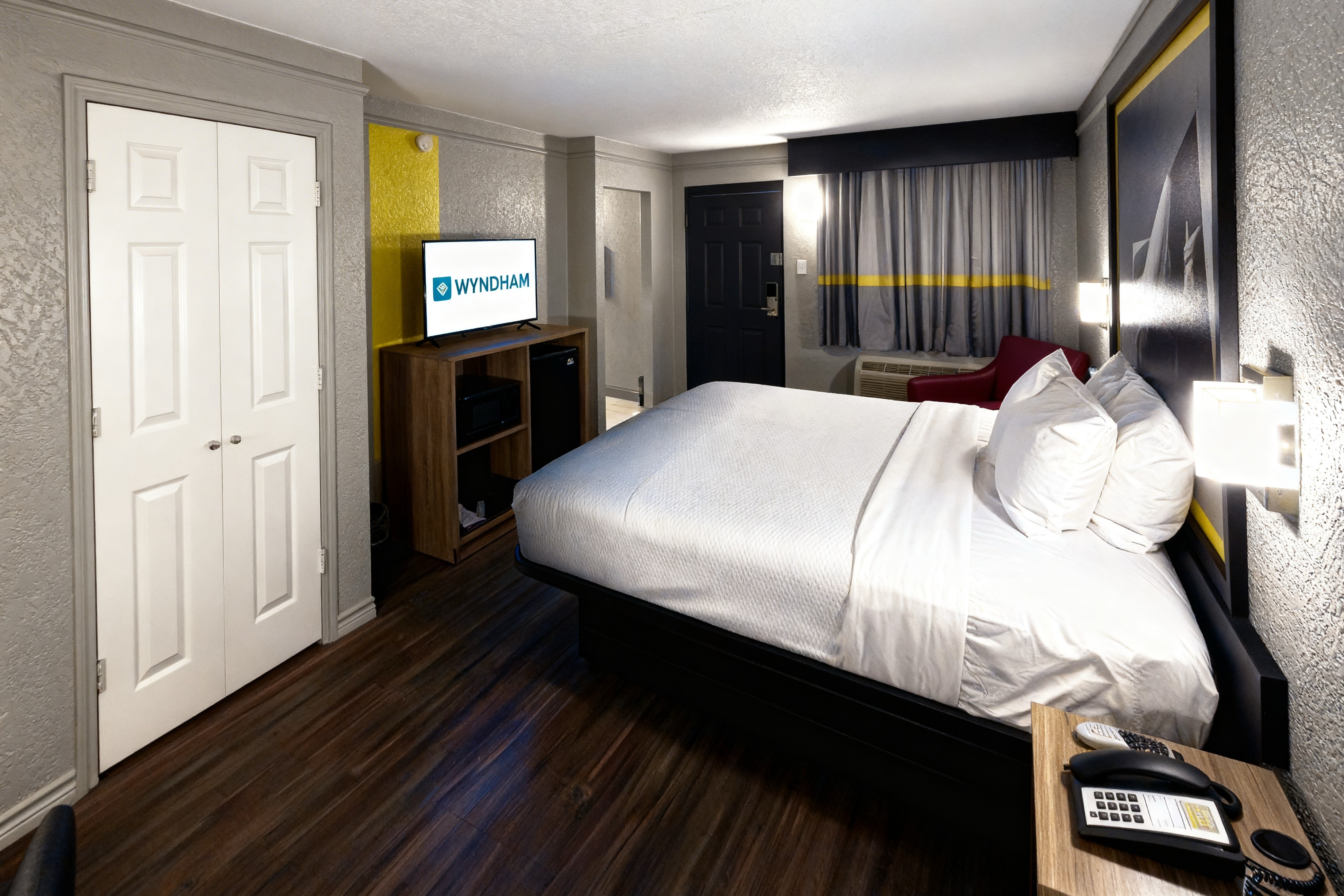 Guest room at the Super 8 by Wyndham Nacogdoches Near University in Nacogdoches, Texas