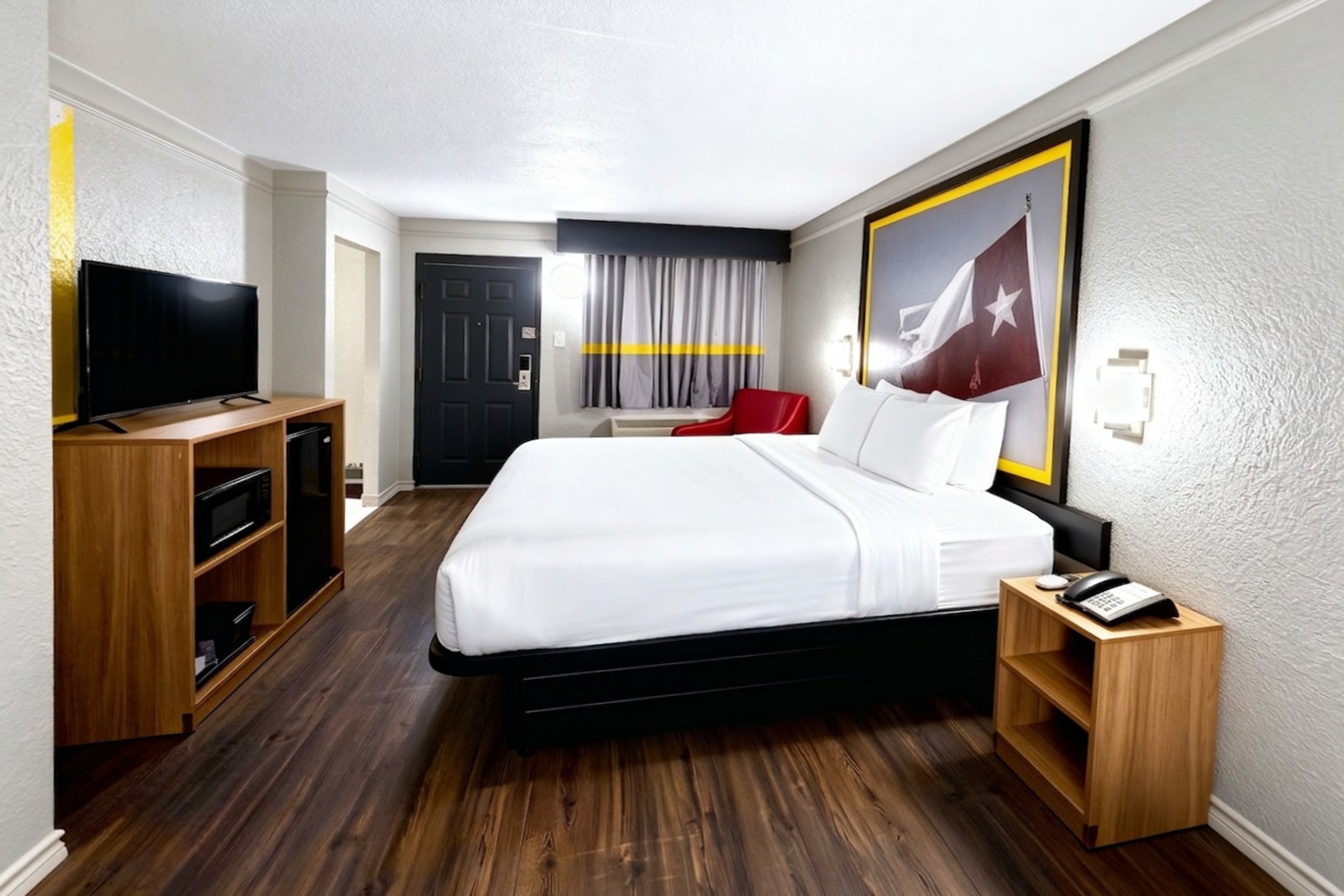 Guest room at the Super 8 by Wyndham Nacogdoches Near University in Nacogdoches, Texas