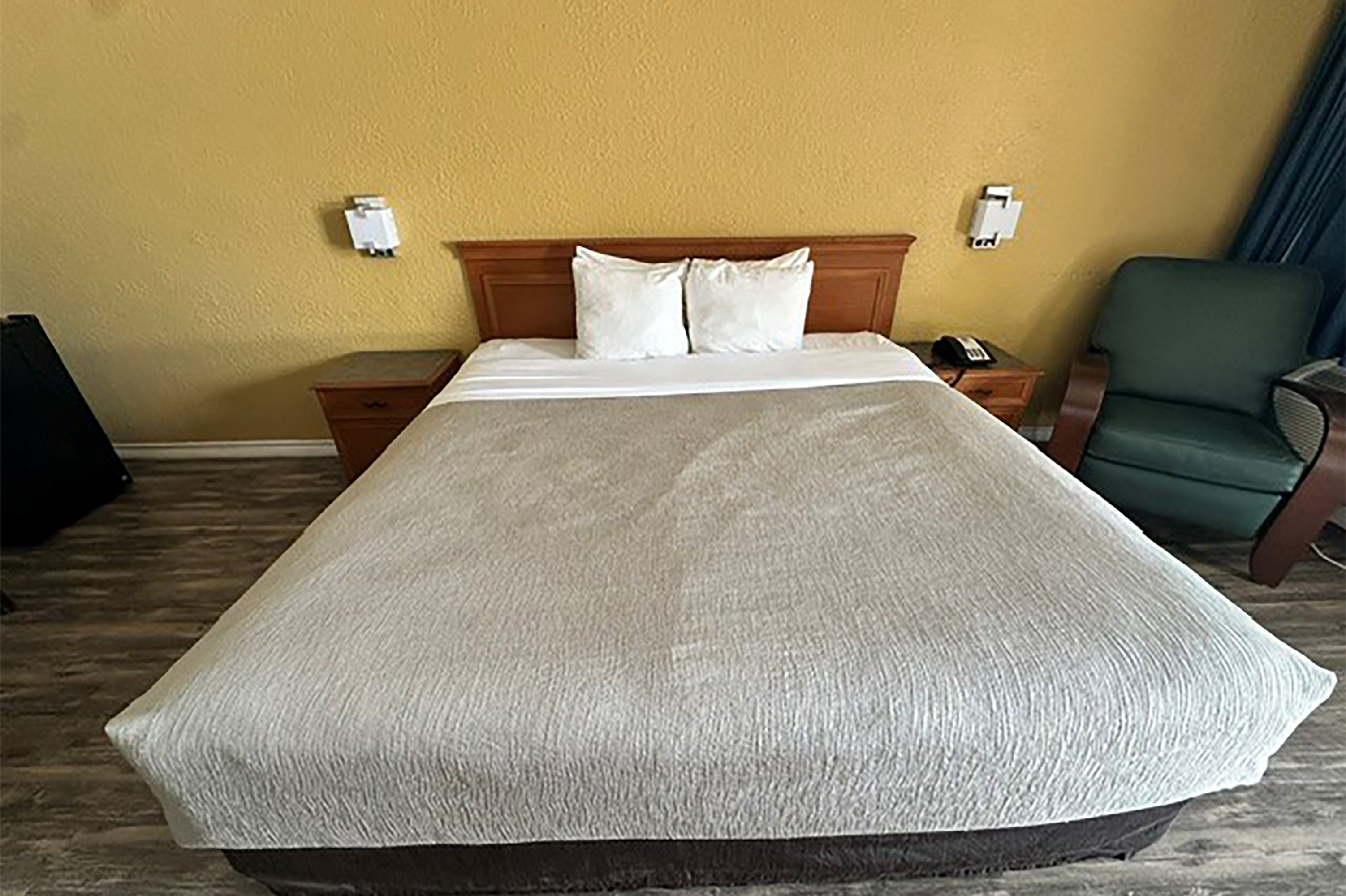 Guest room at the Super 8 by Wyndham Nacogdoches Near University in Nacogdoches, Texas