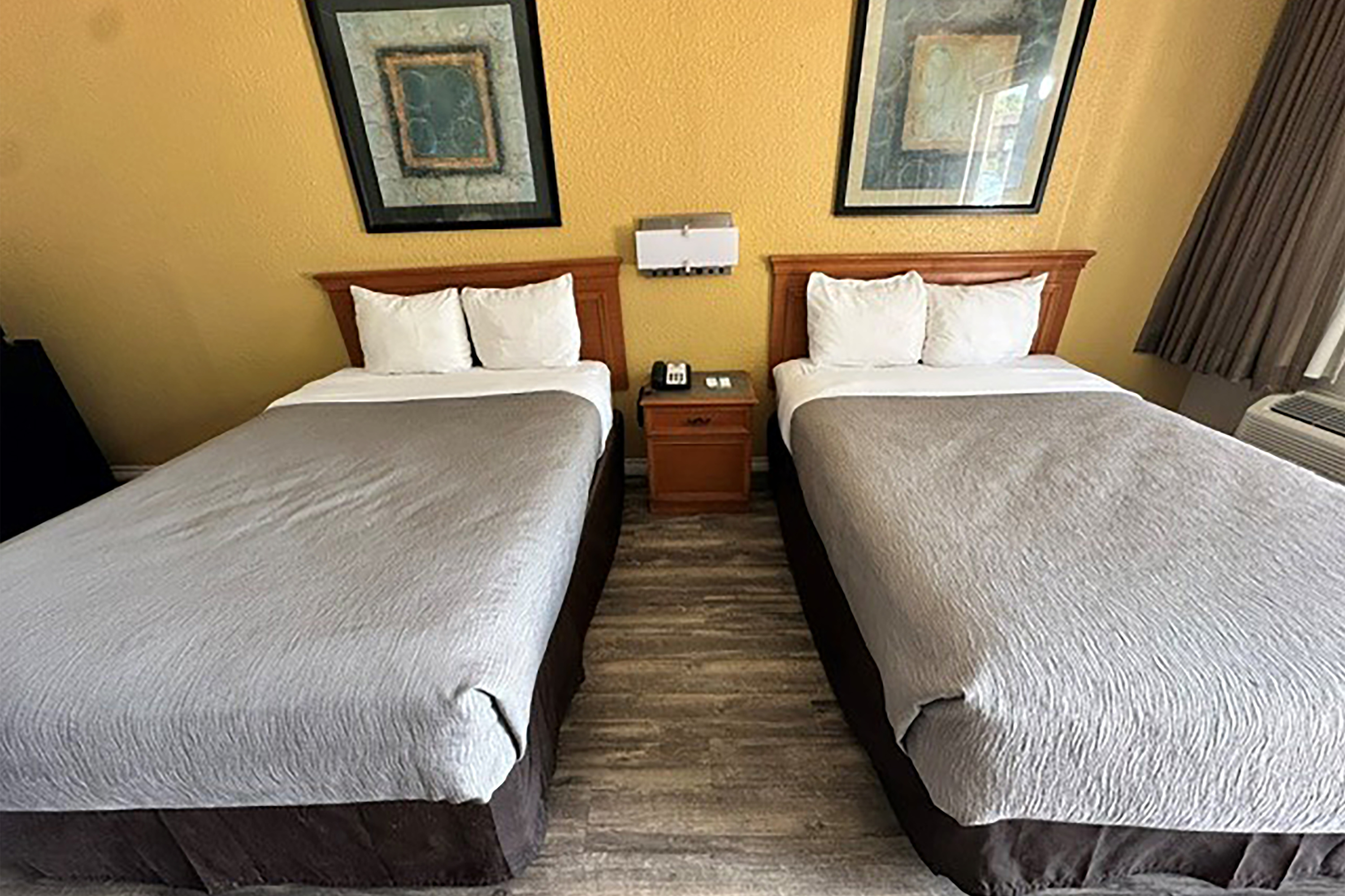 Guest room at the Super 8 by Wyndham Nacogdoches Near University in Nacogdoches, Texas