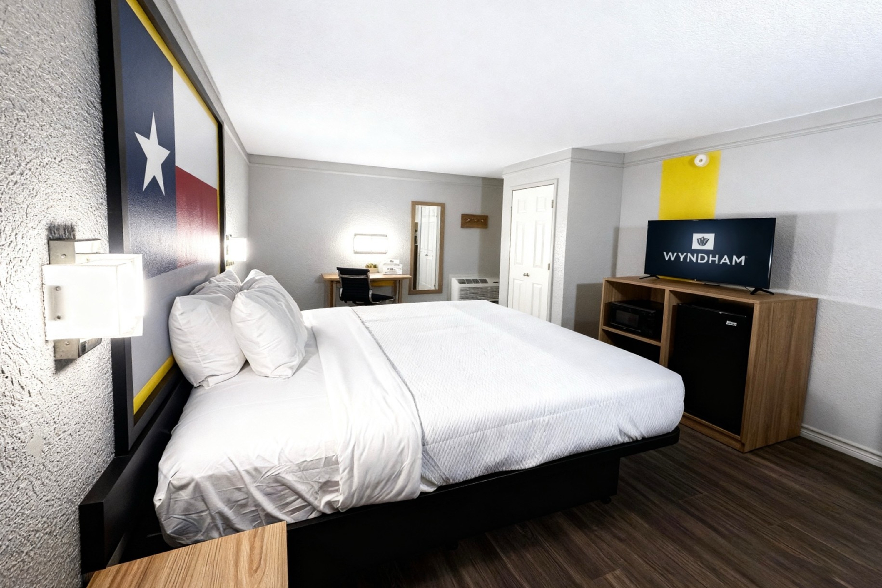 Guest room at the Super 8 by Wyndham Nacogdoches Near University in Nacogdoches, Texas