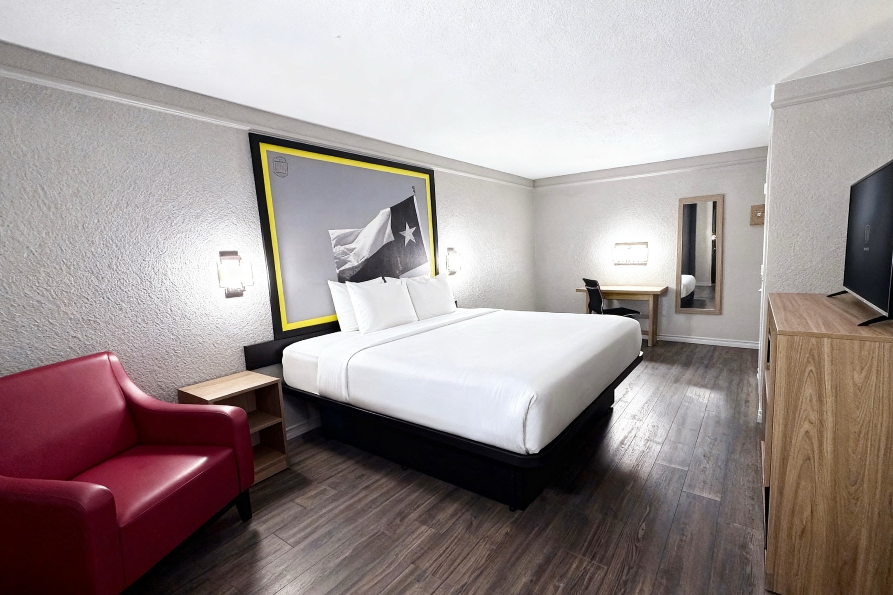 Guest room at the Super 8 by Wyndham Nacogdoches Near University in Nacogdoches, Texas