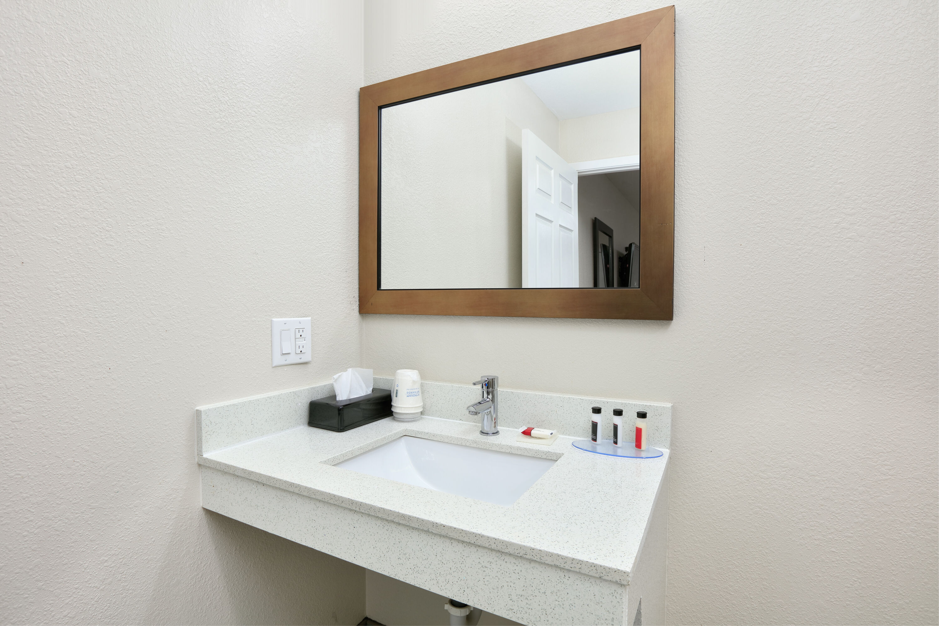 Guest room bath at the Super 8 by Wyndham Palestine TX in Palestine, Texas