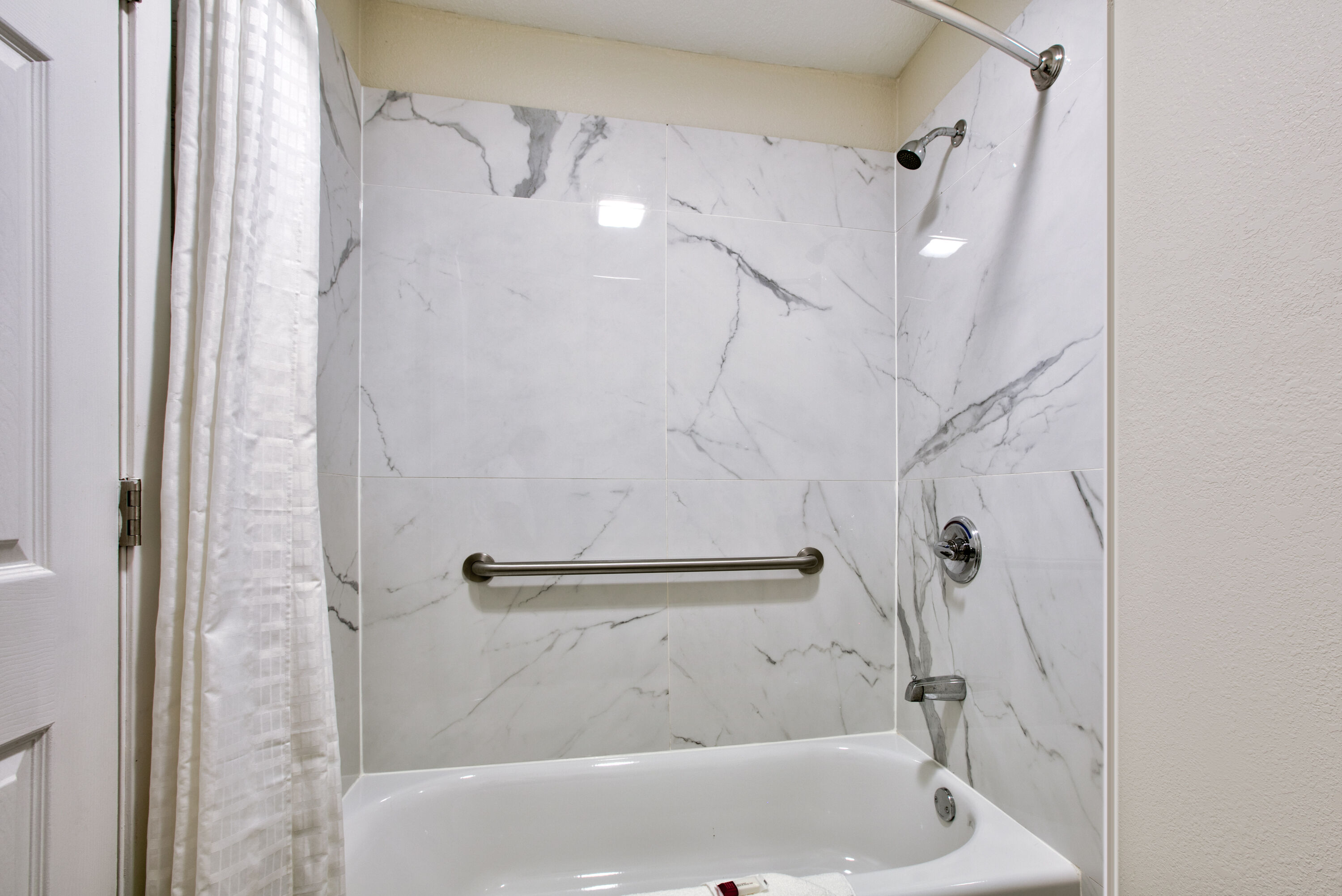 Guest room bath at the Super 8 by Wyndham Palestine TX in Palestine, Texas