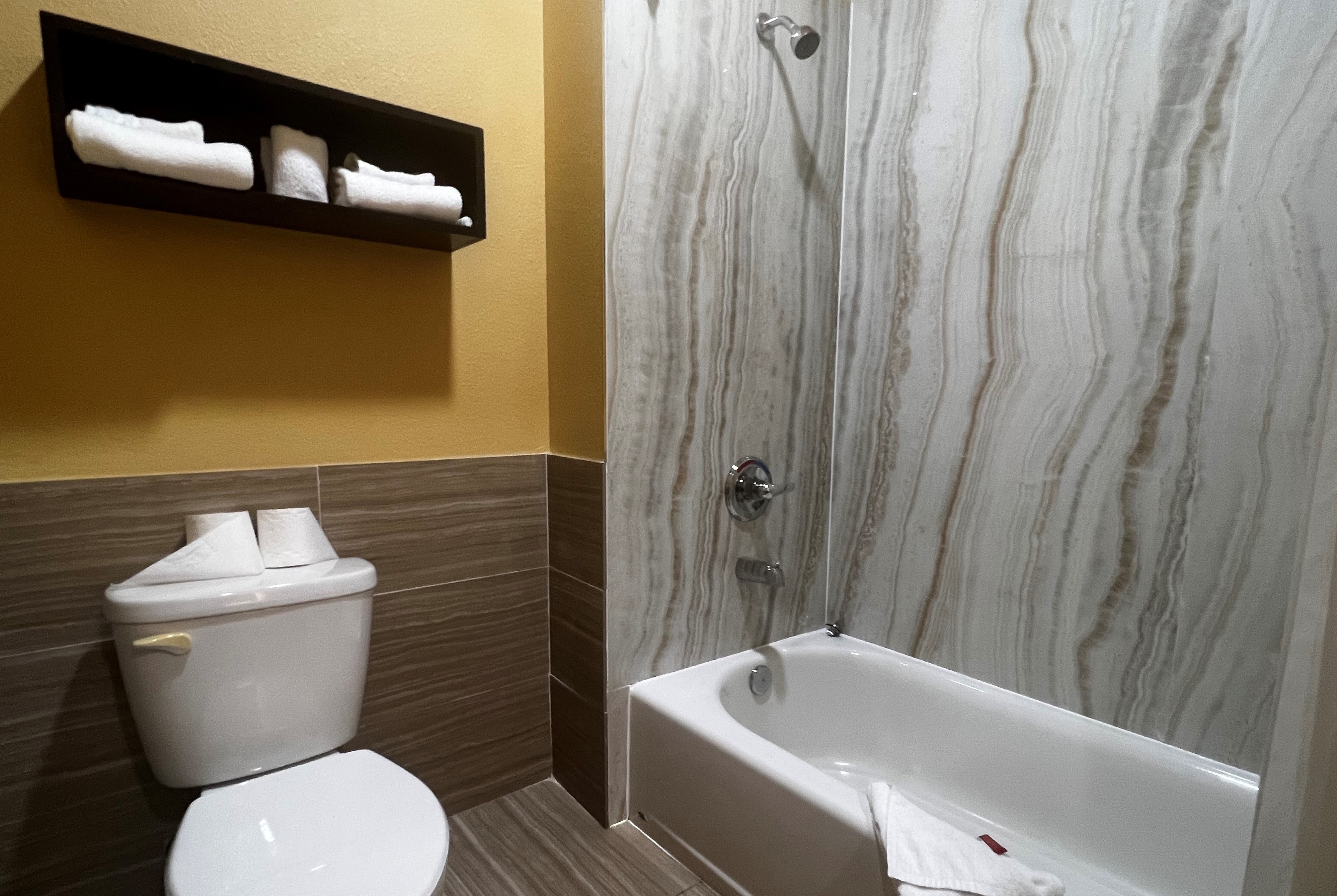 Guest room bath at the Super 8 by Wyndham Pasadena in Pasadena, Texas