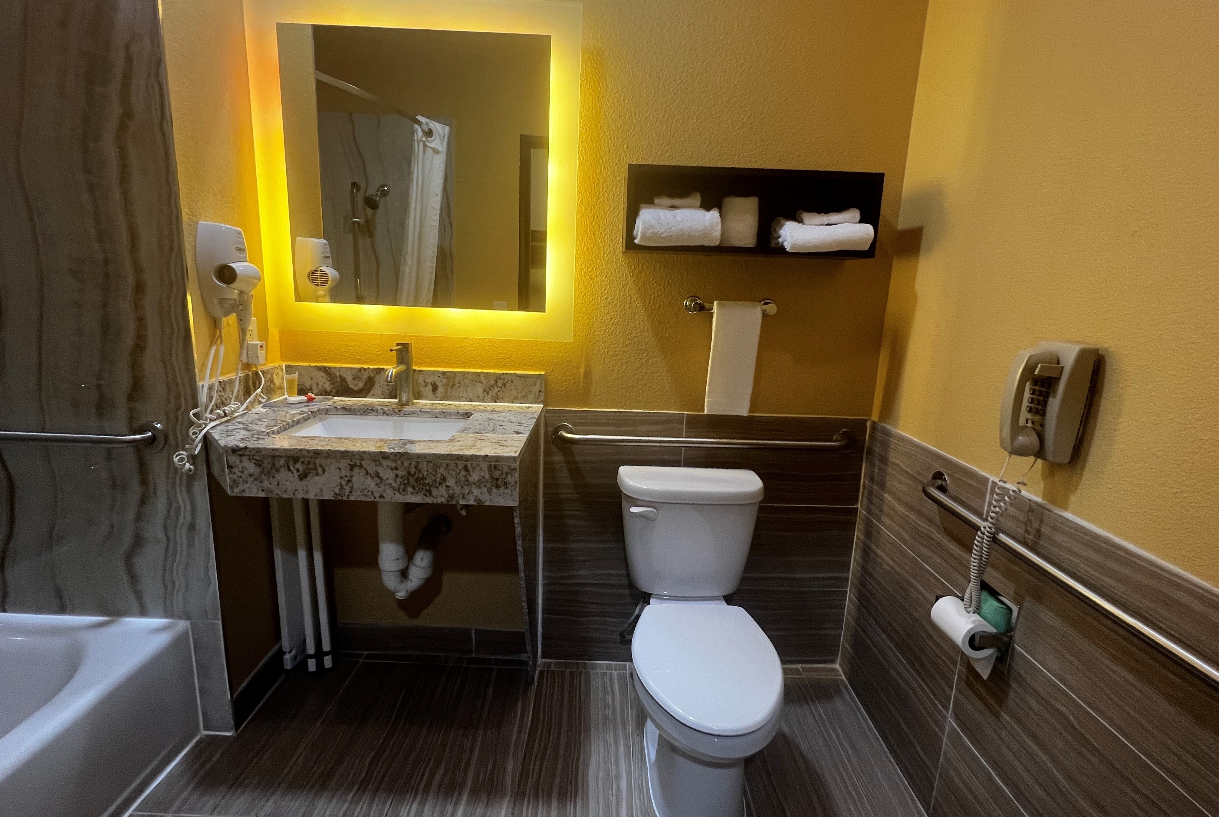 Guest room bath at the Super 8 by Wyndham Pasadena in Pasadena, Texas