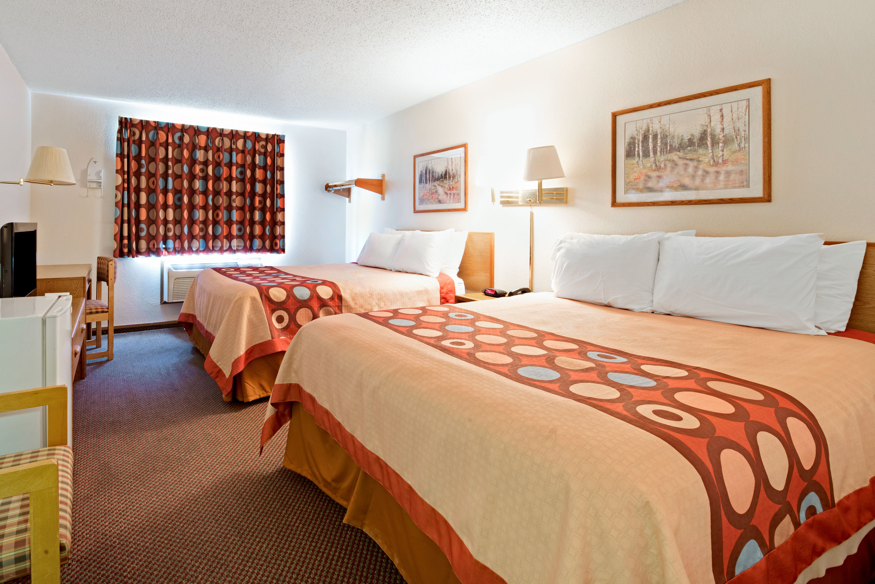 Guest room at the Super 8 by Wyndham Plano/Dallas Area in Plano, Texas
