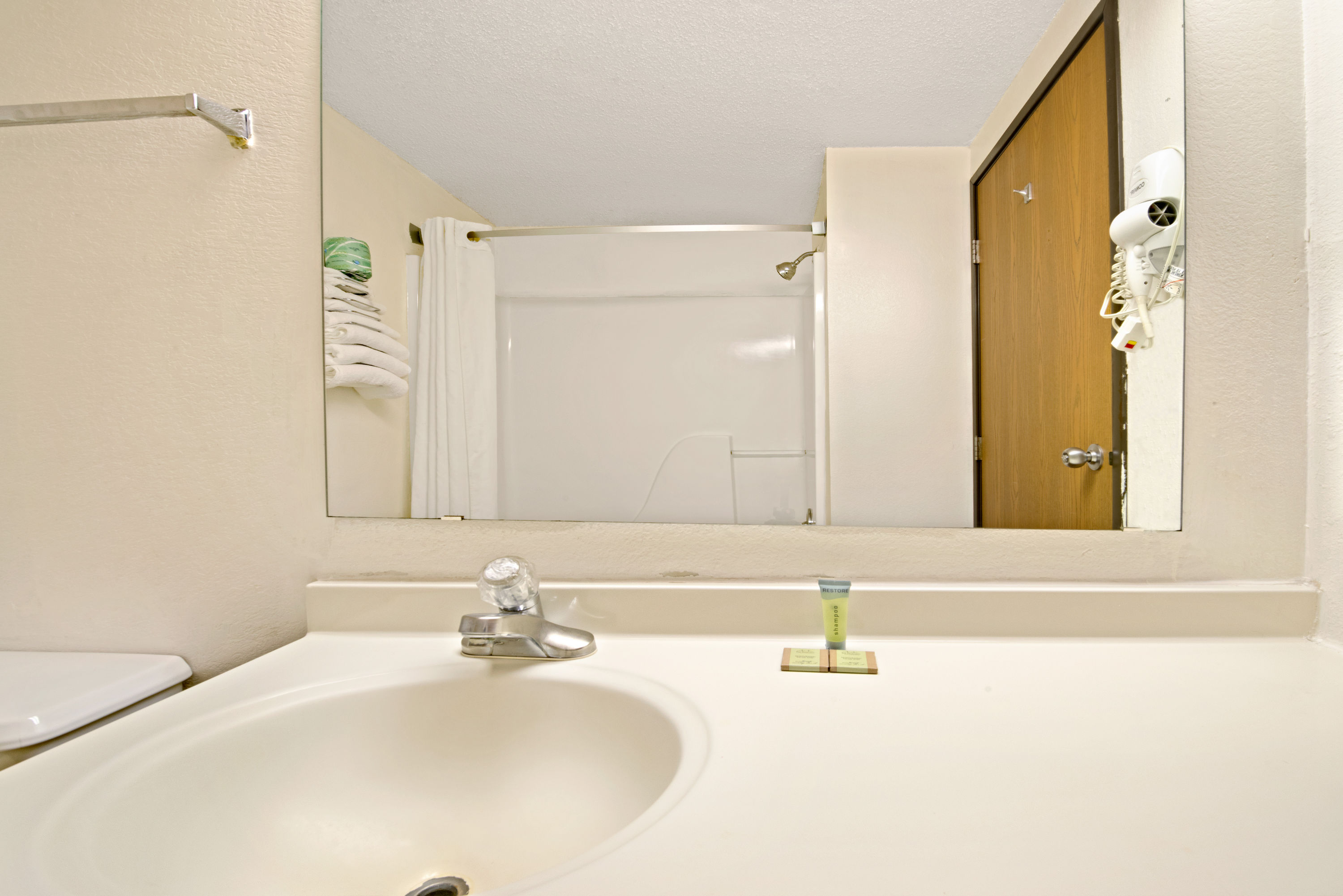 Guest room at the Super 8 by Wyndham Plano/Dallas Area in Plano, Texas