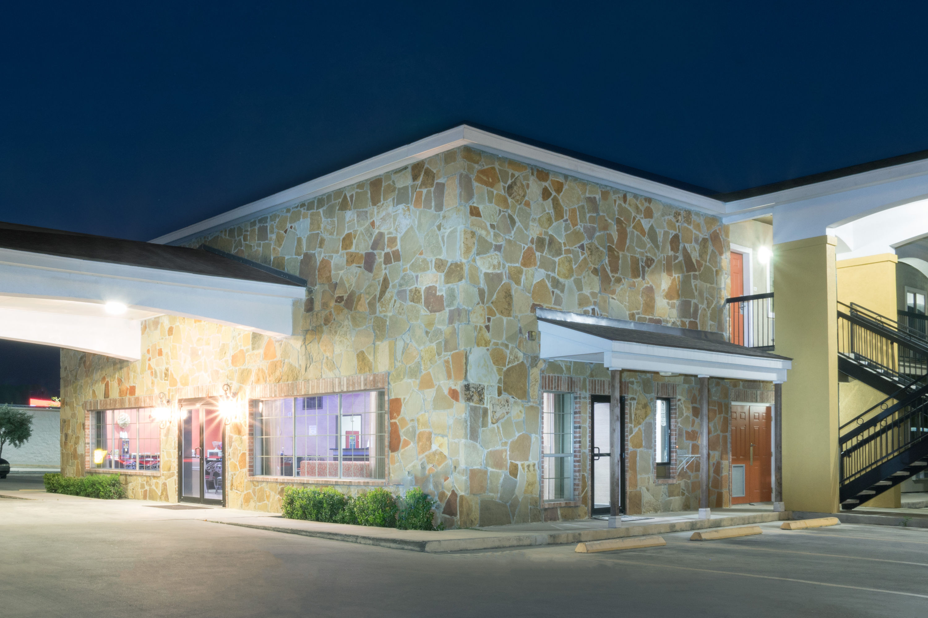 Exterior Night Image of Super 8 by Wyndham San Antonio Near Fort Sam Houston hotel in San Antonio, Texas