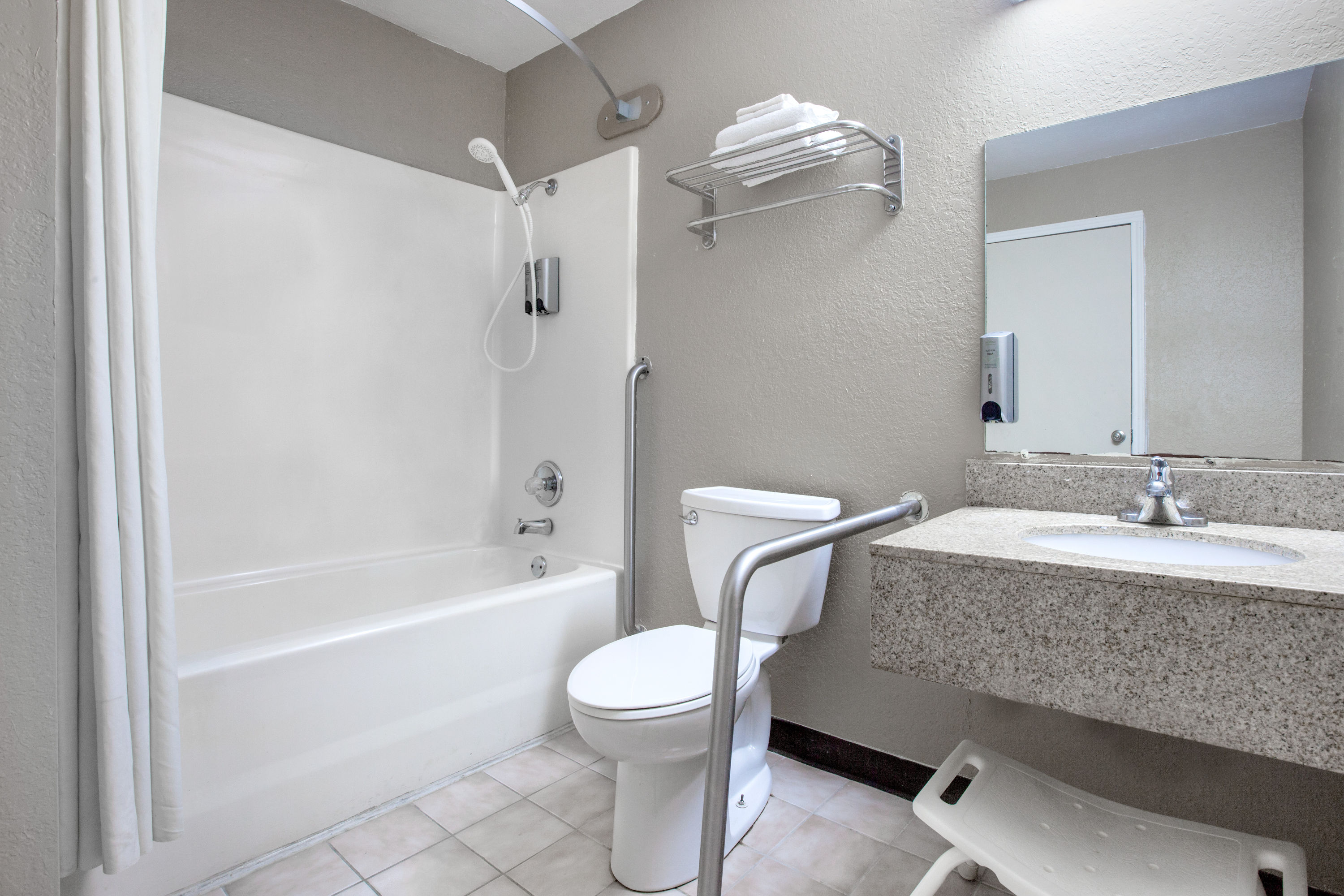 Guest room bath at the Super 8 by Wyndham Sherman in Sherman, Texas