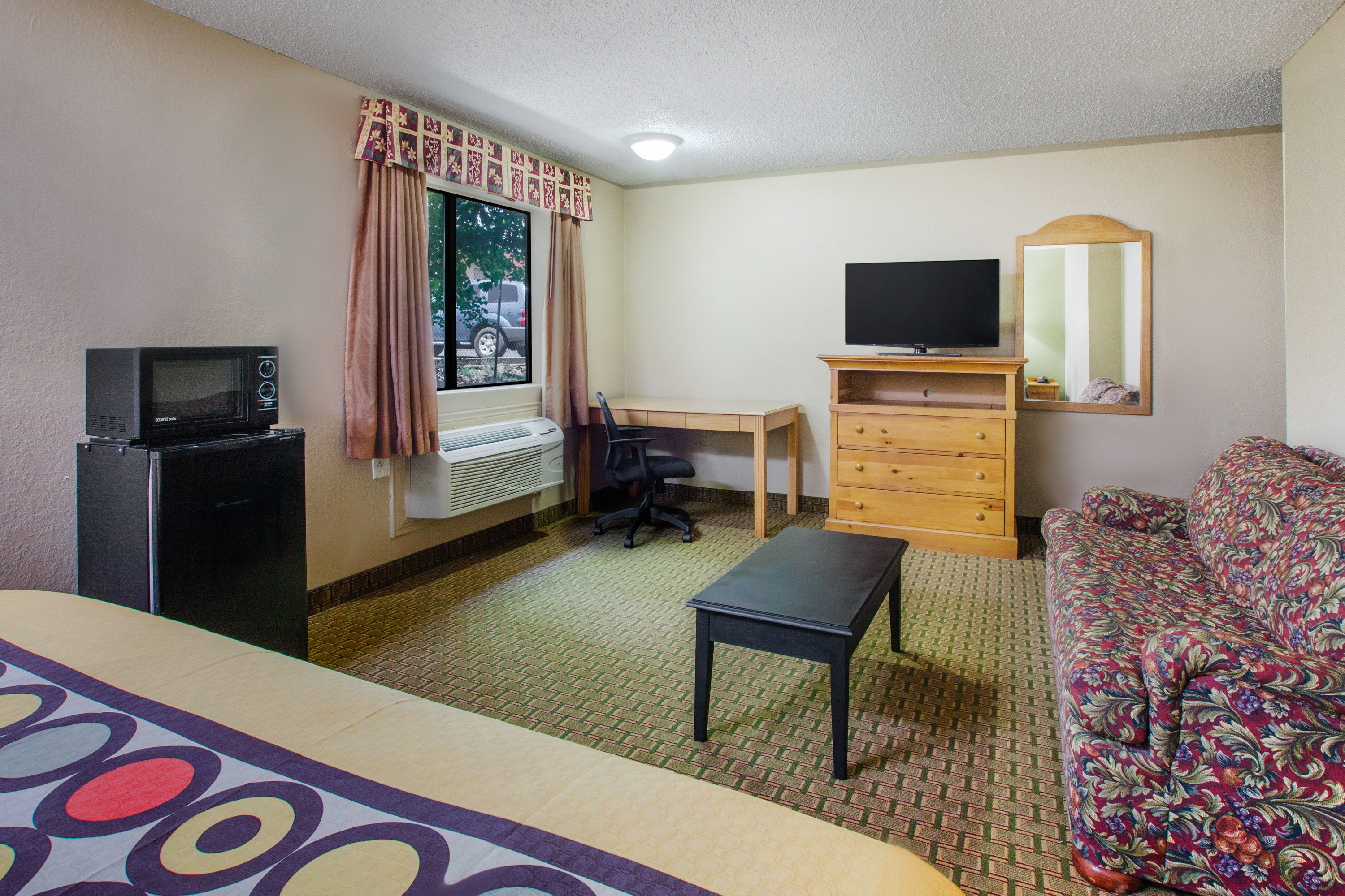 Guest room at the Super 8 by Wyndham Sherman in Sherman, Texas