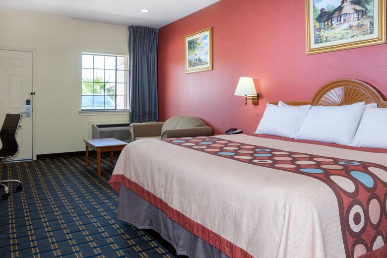 Guest room at the Super 8 Stafford Sugarland Area in Stafford, Texas