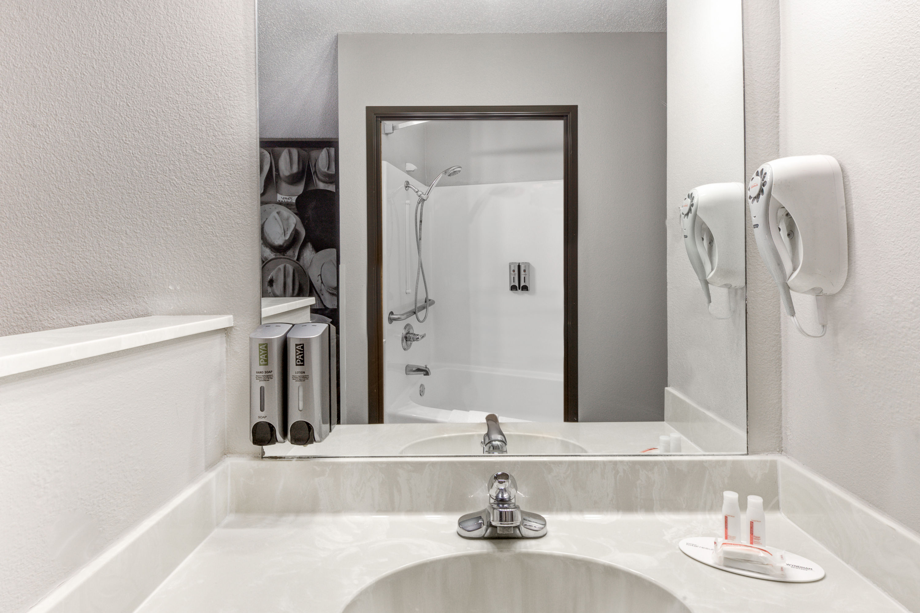 Guest room bath at the Super 8 by Wyndham Victoria/North/Mall Area in Victoria, Texas