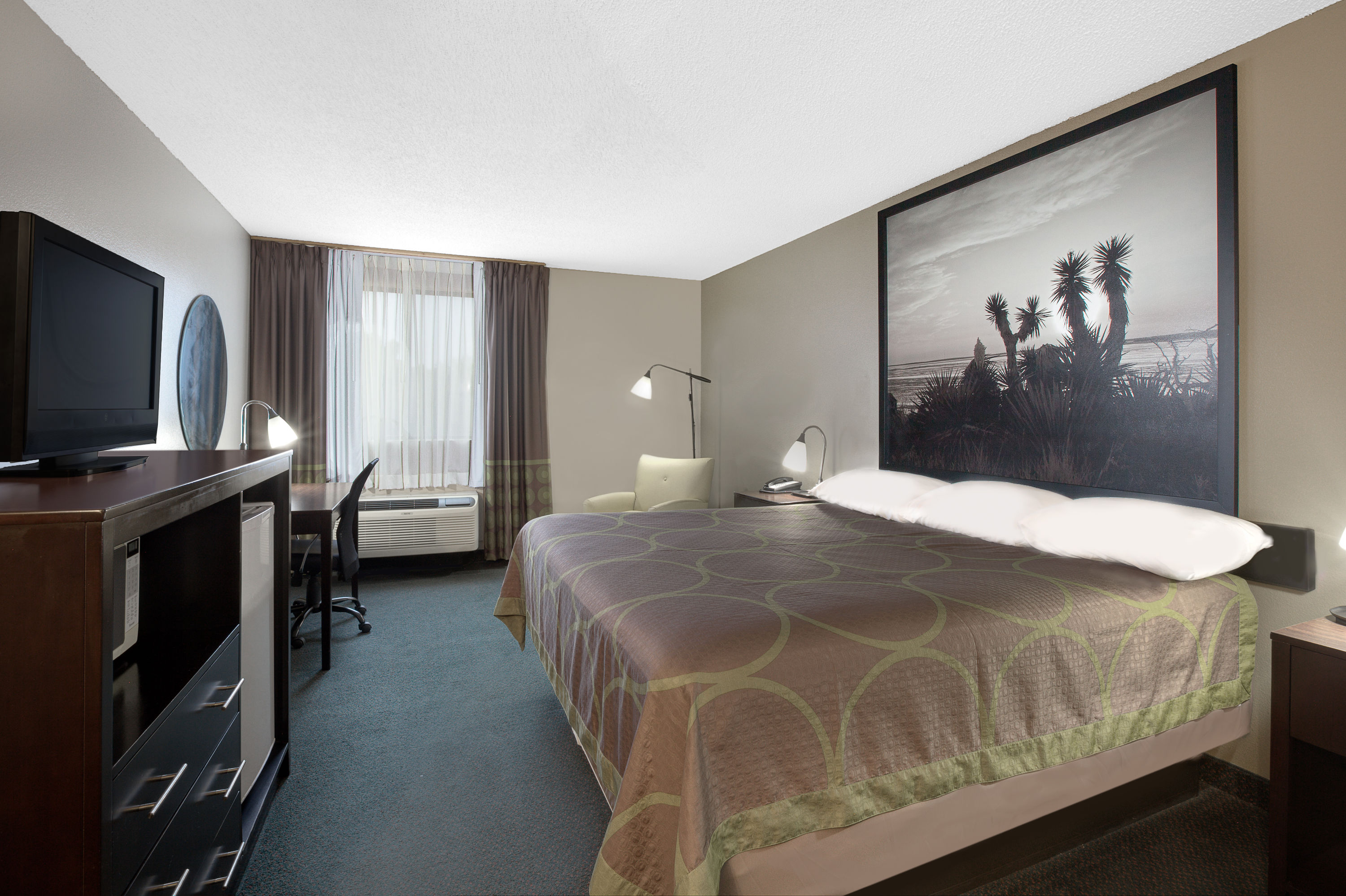 Guest room at the Super 8 by Wyndham Victoria/North/Mall Area in Victoria, Texas