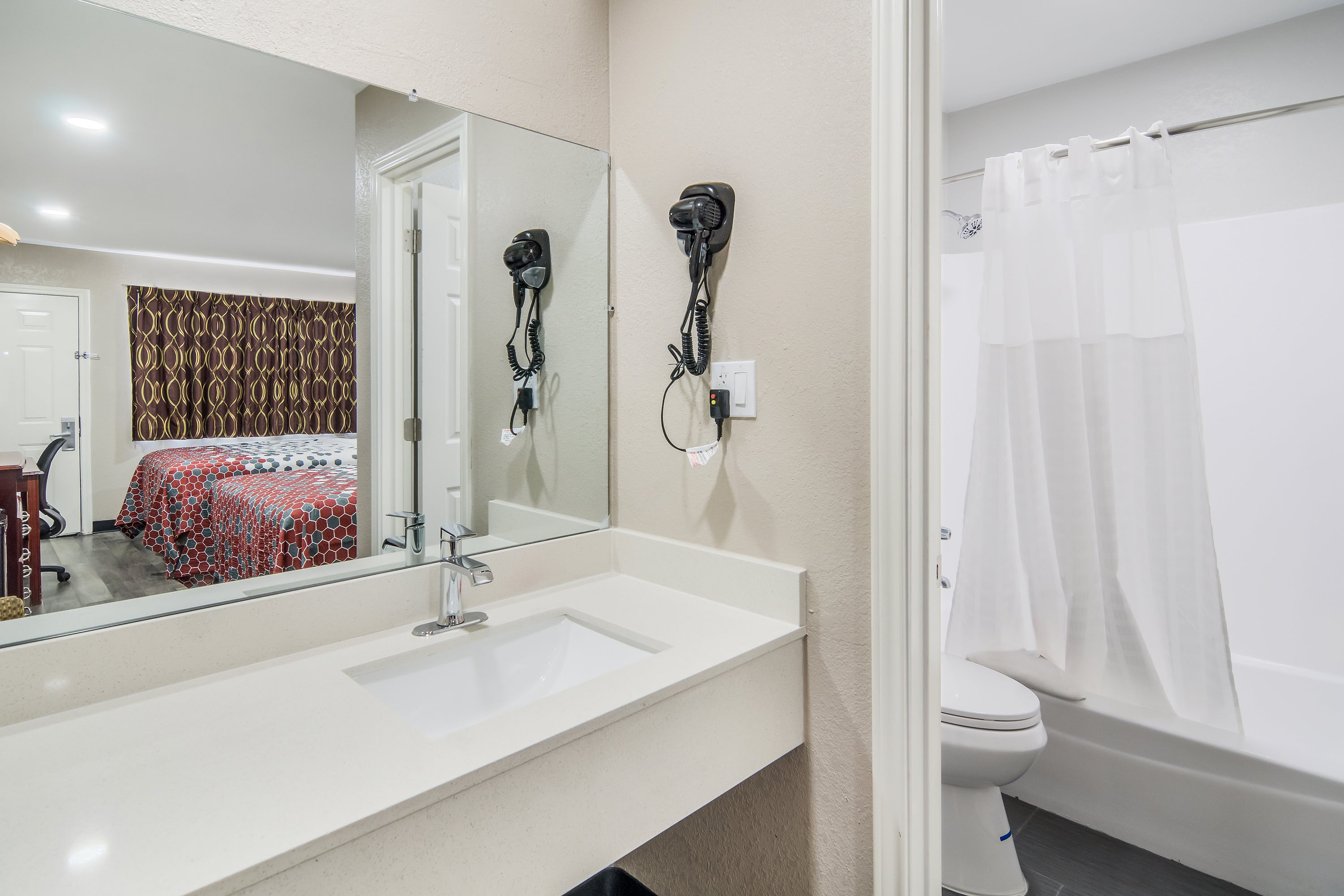 Guest room bath at the Super 8 by Wyndham Waco North I-35 in Waco, Texas