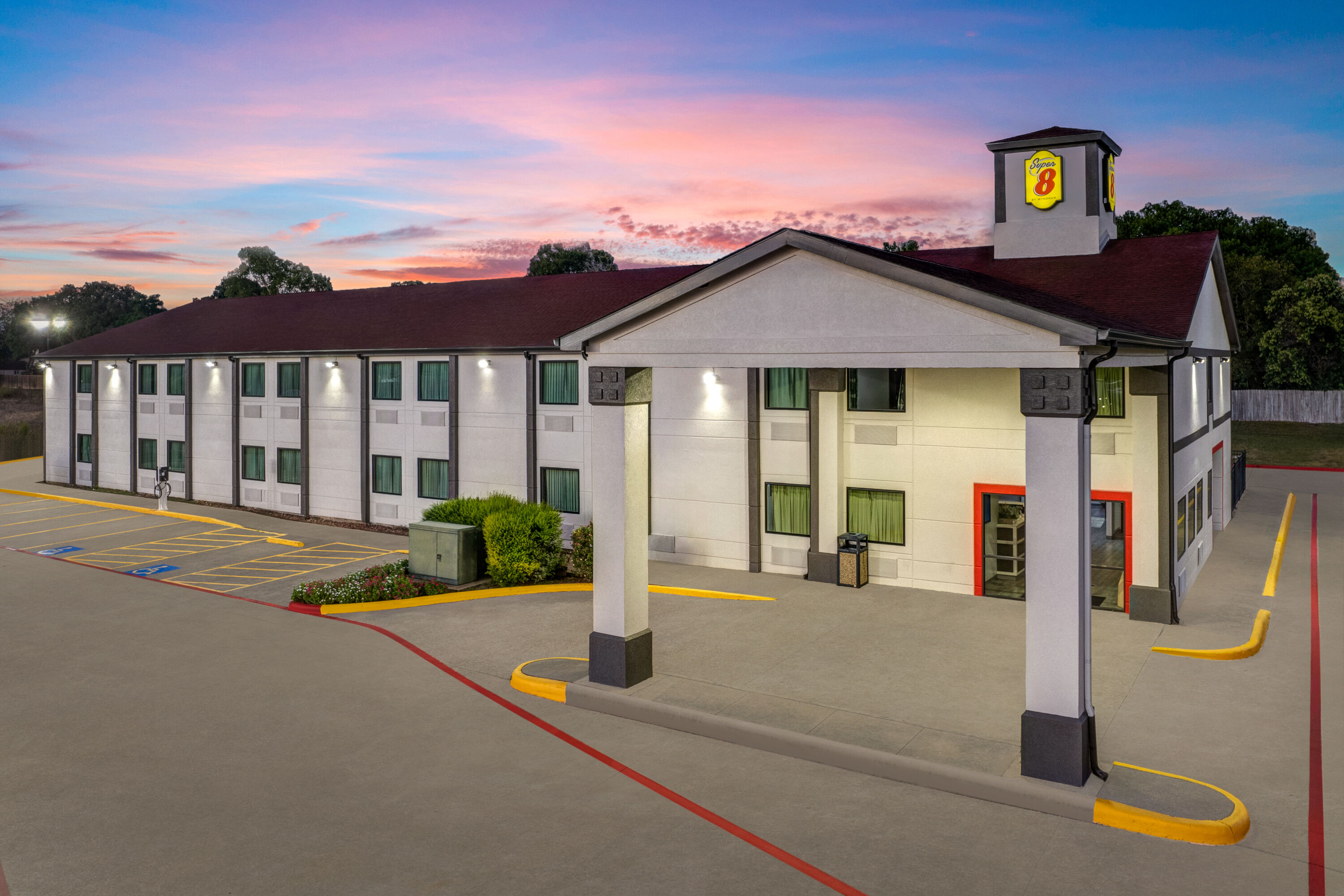 Exterior Dusk Image of Super 8 by Wyndham Waxahachie TX hotel in Waxahachie, Texas
