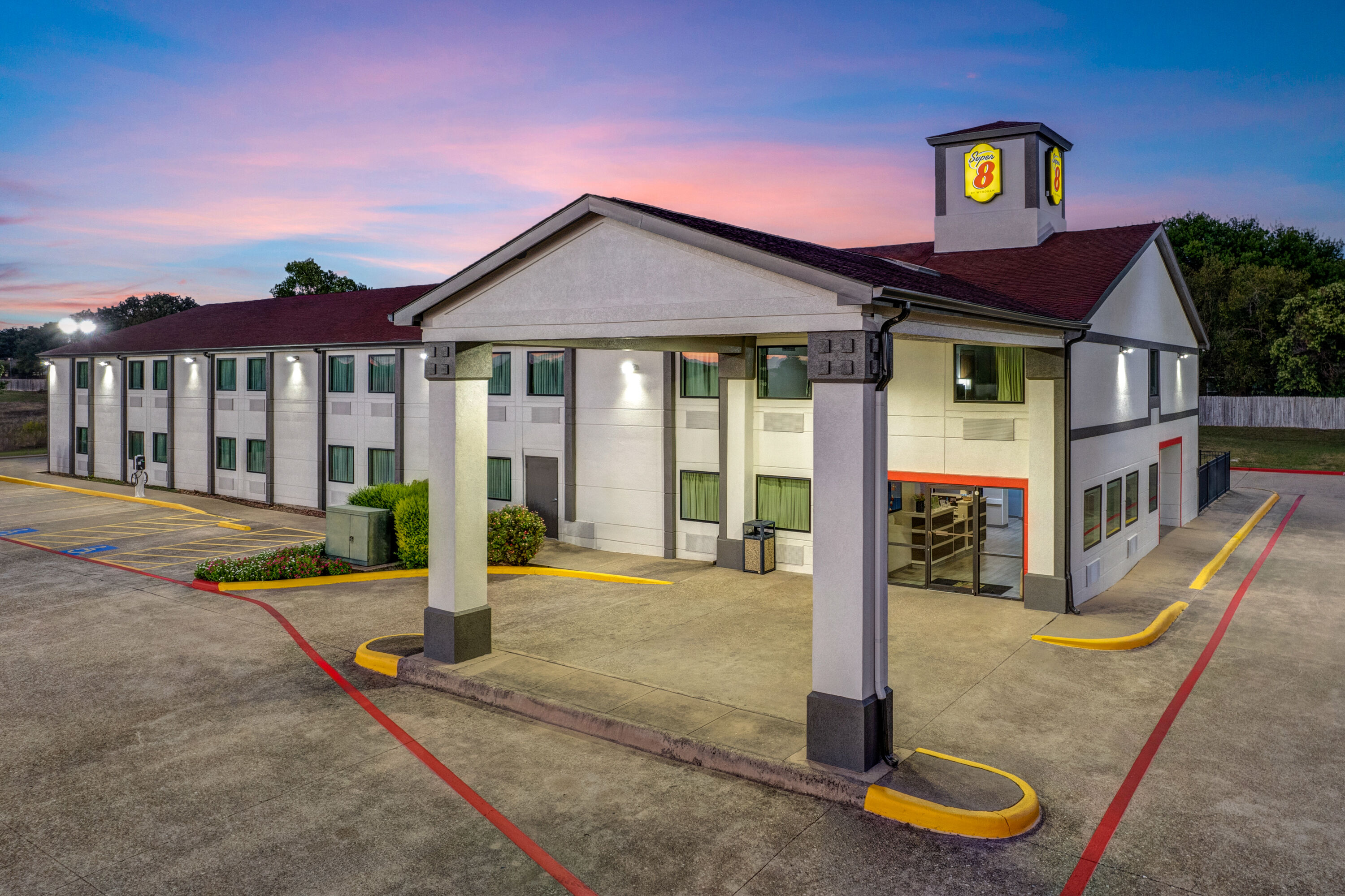 Exterior Dusk Image of Super 8 by Wyndham Waxahachie TX hotel in Waxahachie, Texas