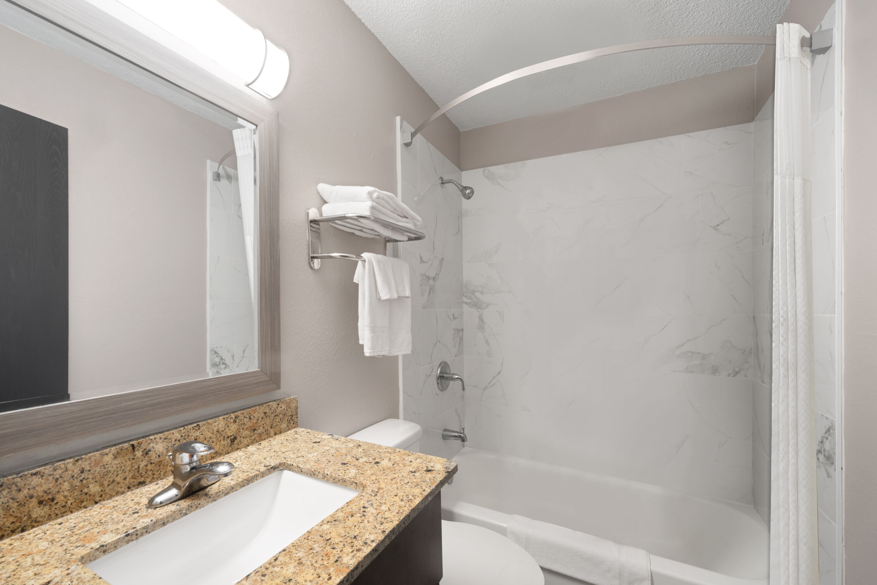 Guest room bath at the Super 8 by Wyndham Farmville in Farmville, Virginia