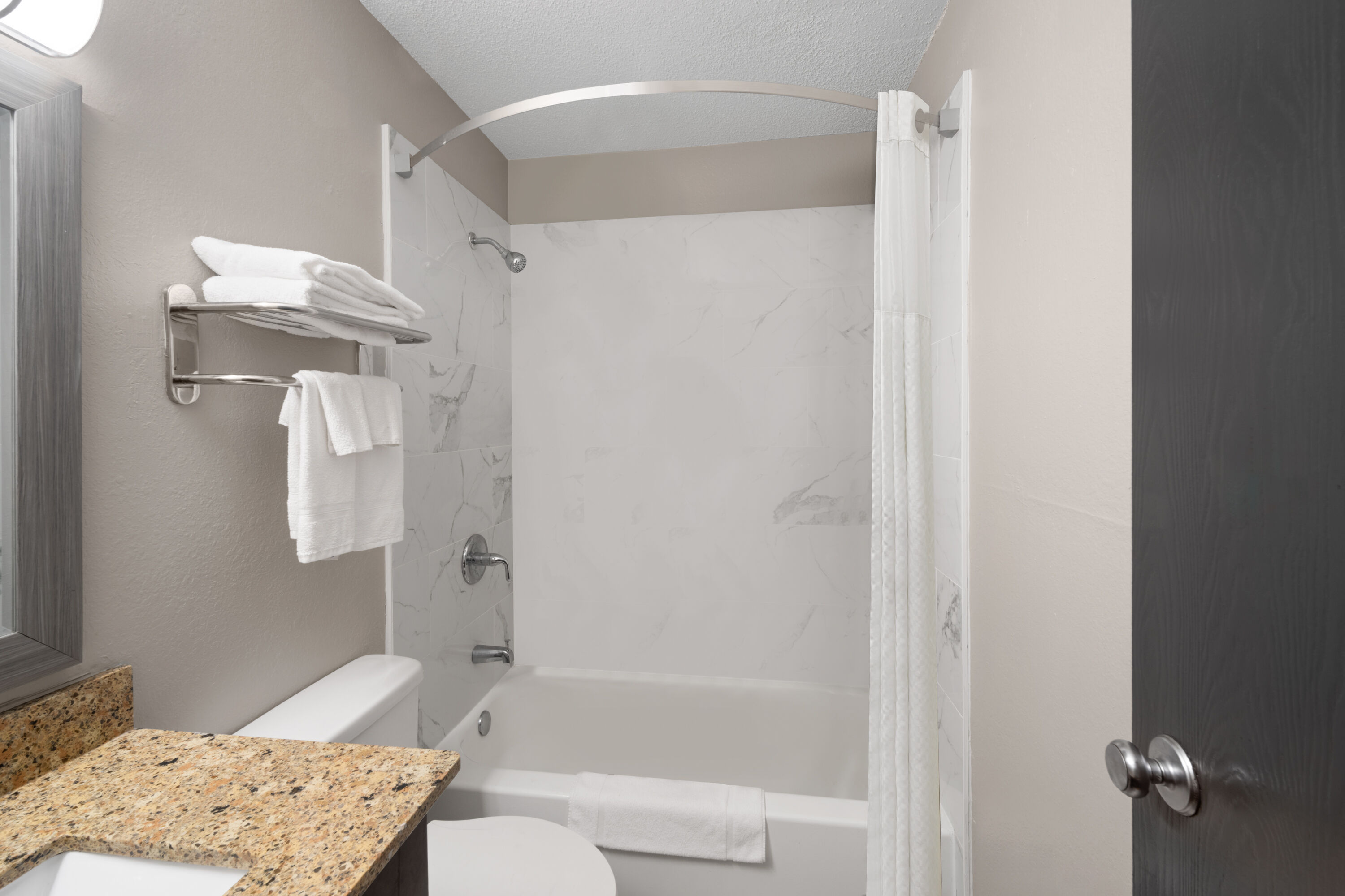 Guest room bath at the Super 8 by Wyndham Farmville in Farmville, Virginia