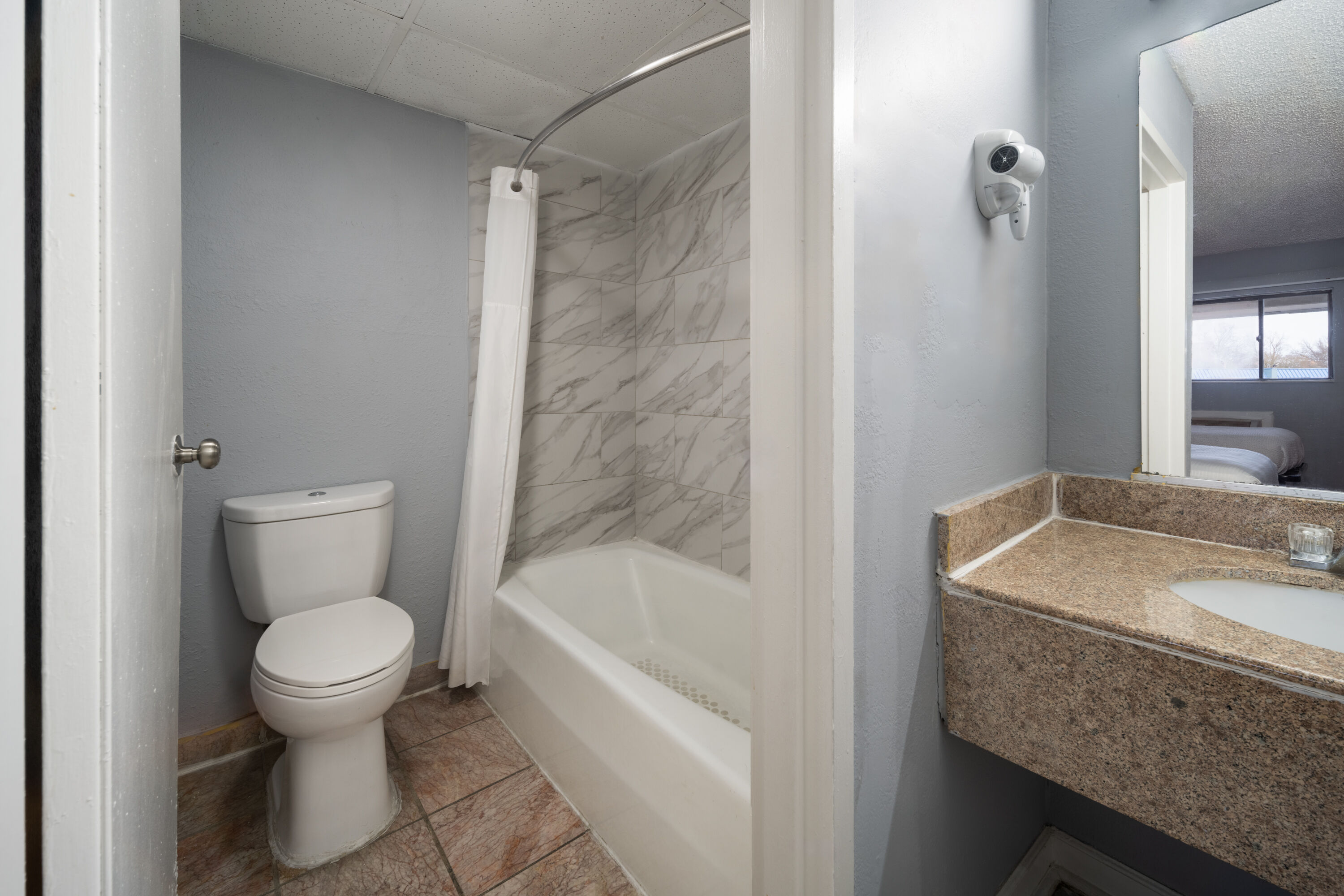 Guest room bath at the Super 8 by Wyndham Portsmouth - Norfolk in Portsmouth, Virginia