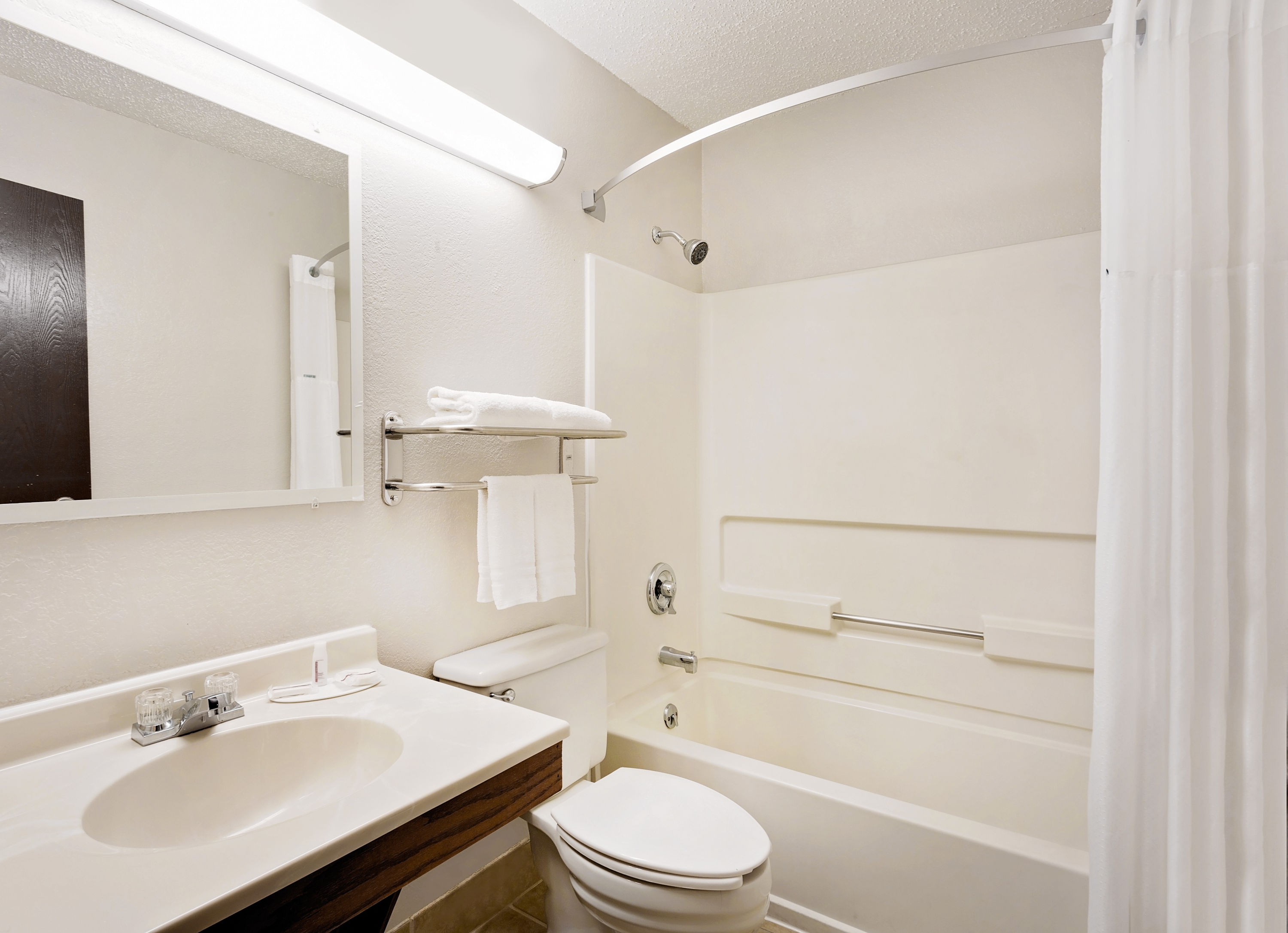 Guest room bath at the Super 8 by Wyndham Waynesboro in Waynesboro, Virginia