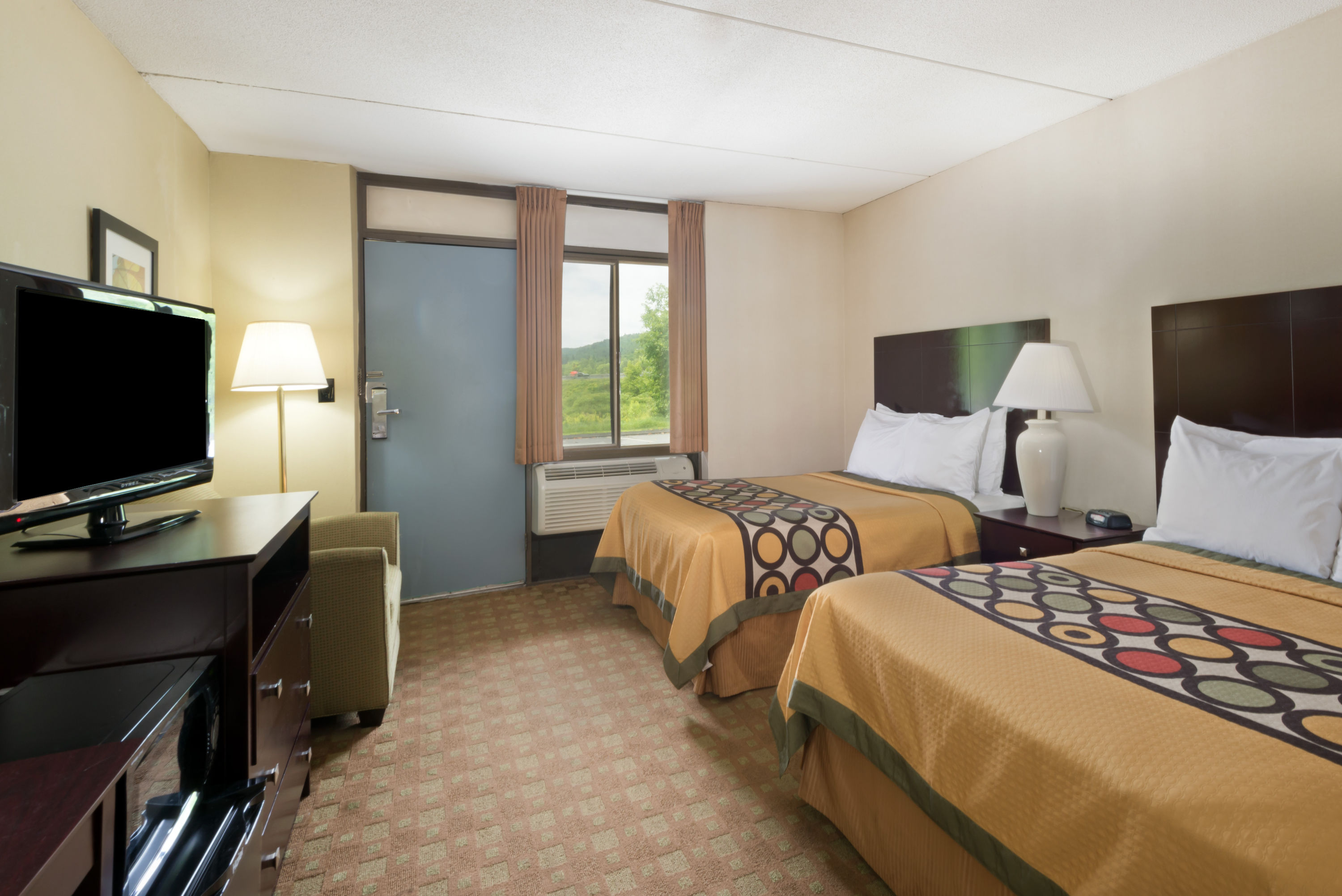 Guest room at the Super 8 by Wyndham White River Junction in White River Junction, Vermont