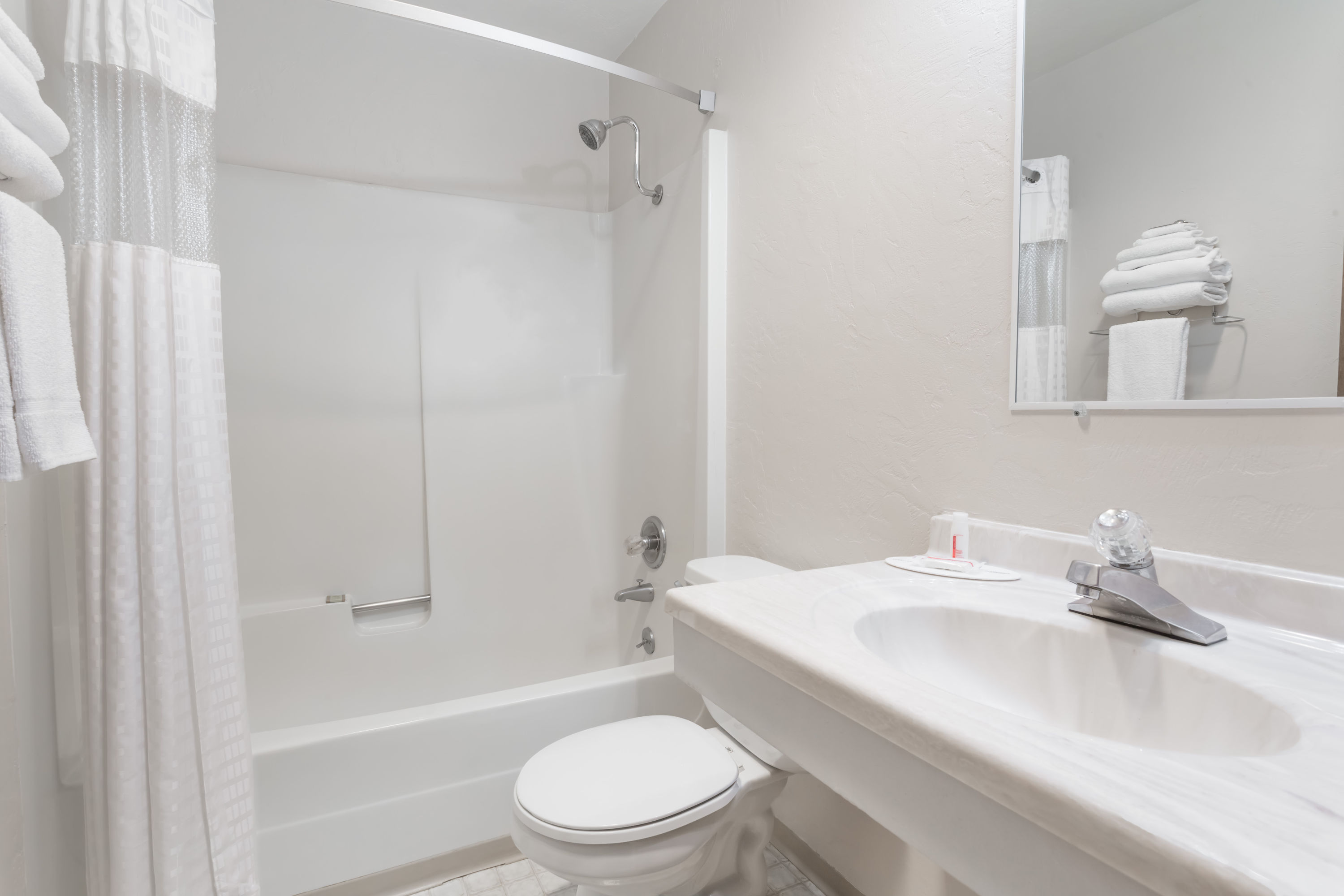 Guest room bath at the Super 8 by Wyndham Shelton in Shelton, Washington