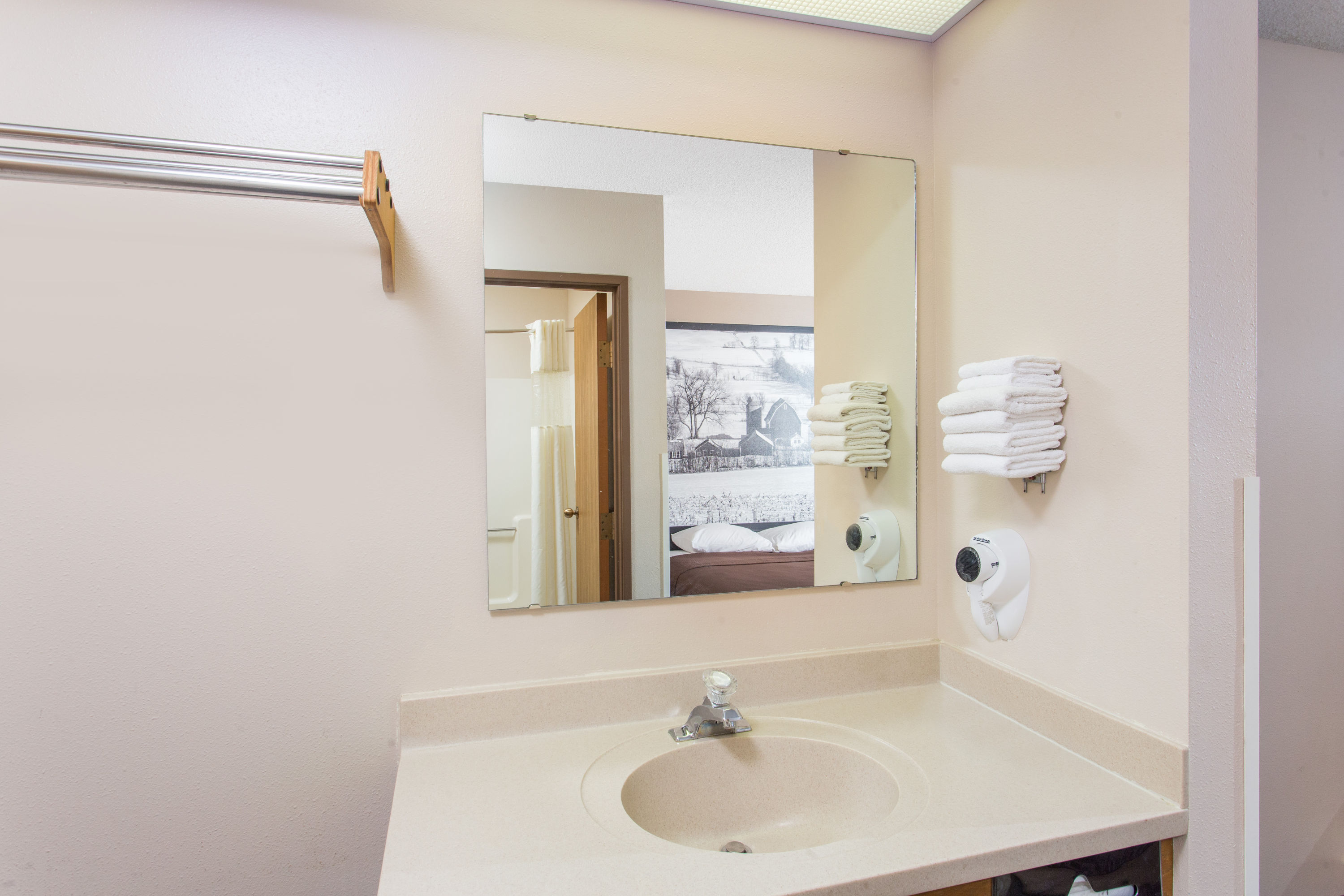 Guest room bath at the Super 8 by Wyndham Dodgeville in Dodgeville, Wisconsin