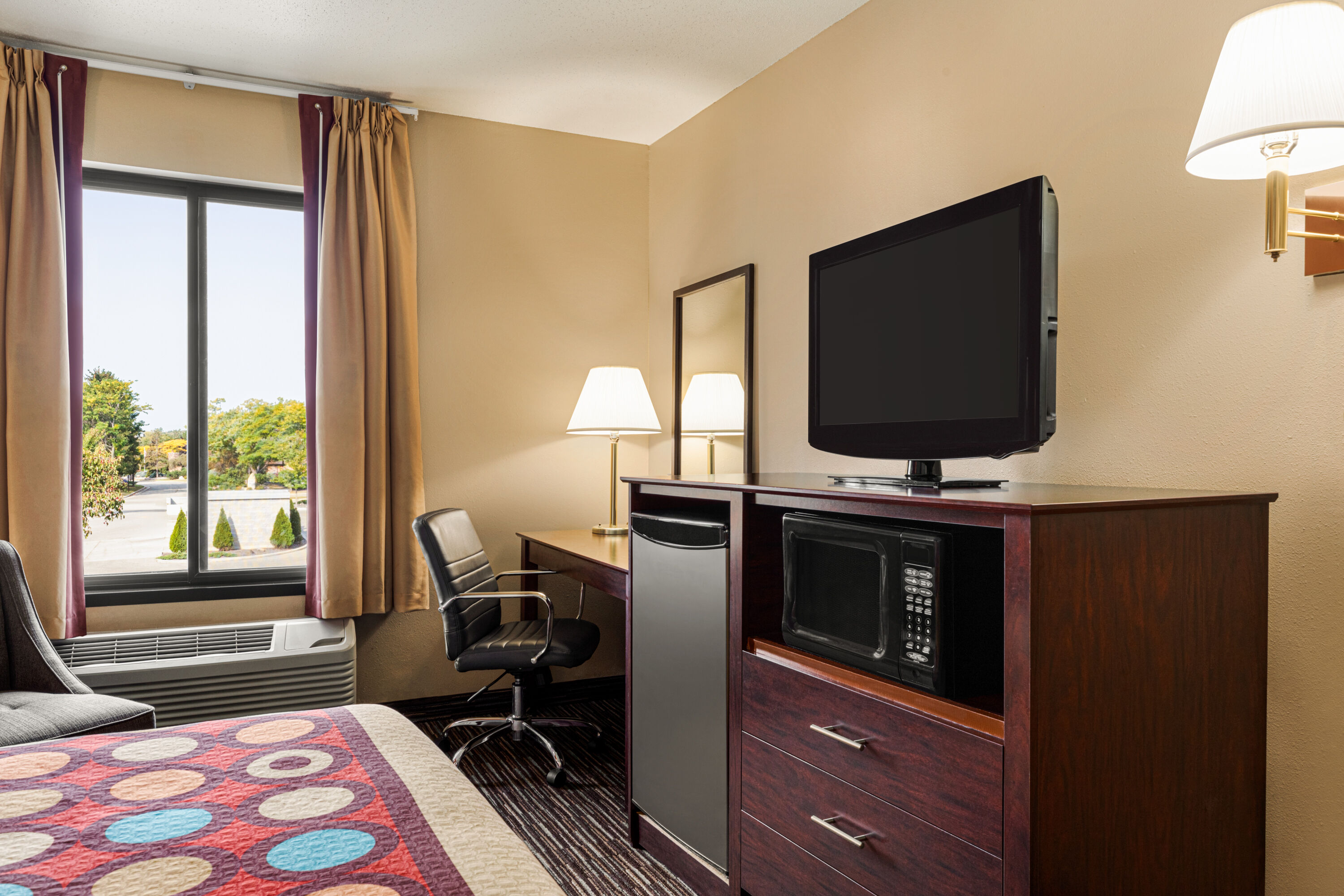 Guest room at the Super 8 by Wyndham Germantown/Milwaukee in Germantown, Wisconsin