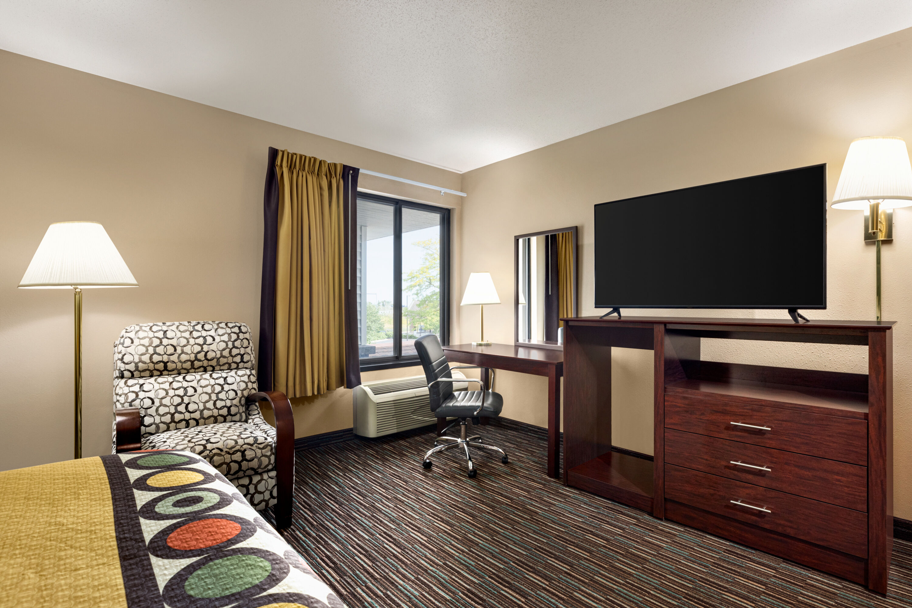 Guest room at the Super 8 by Wyndham Germantown/Milwaukee in Germantown, Wisconsin