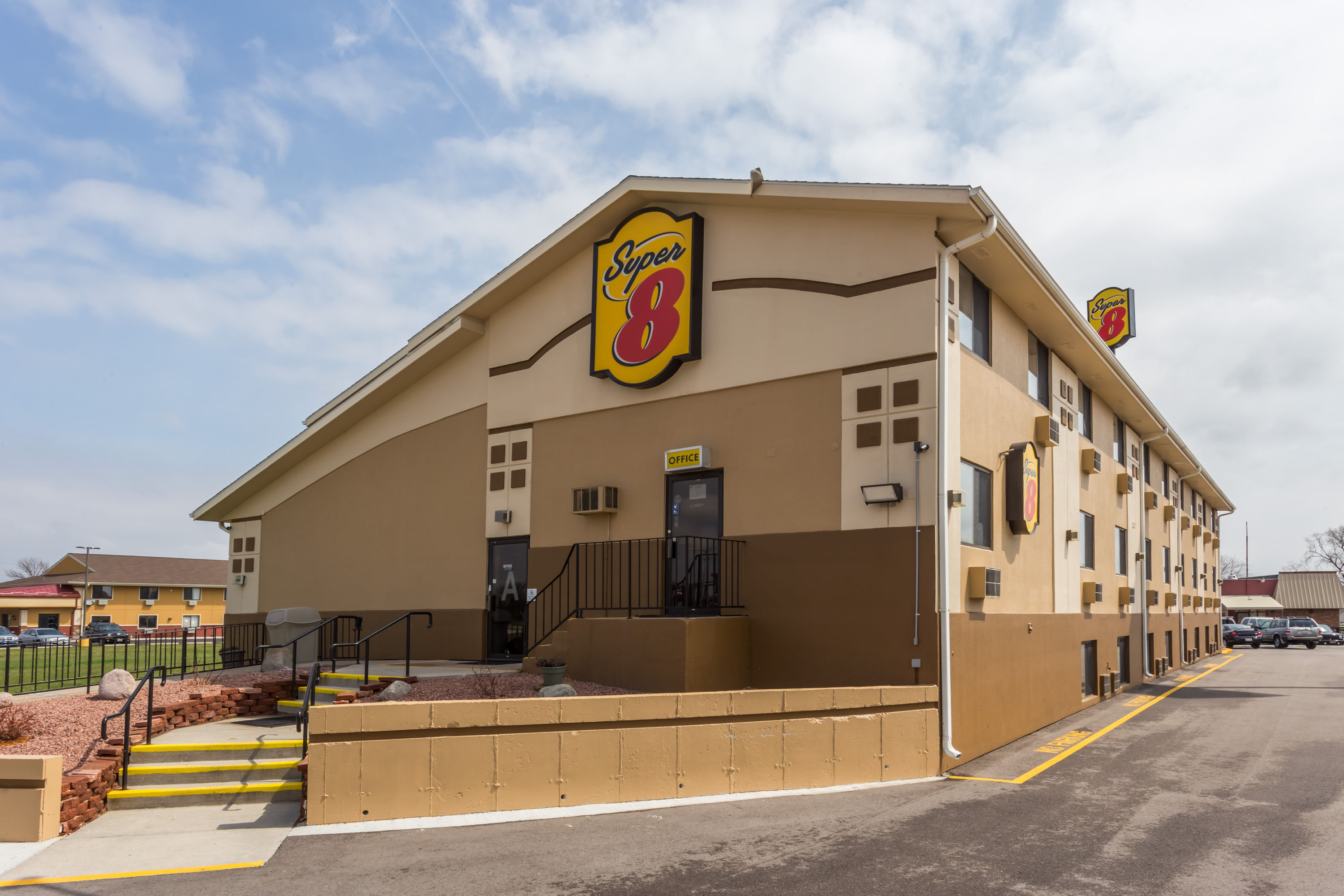 Exterior Day Image of Super 8 by Wyndham Janesville hotel in Janesville, Wisconsin