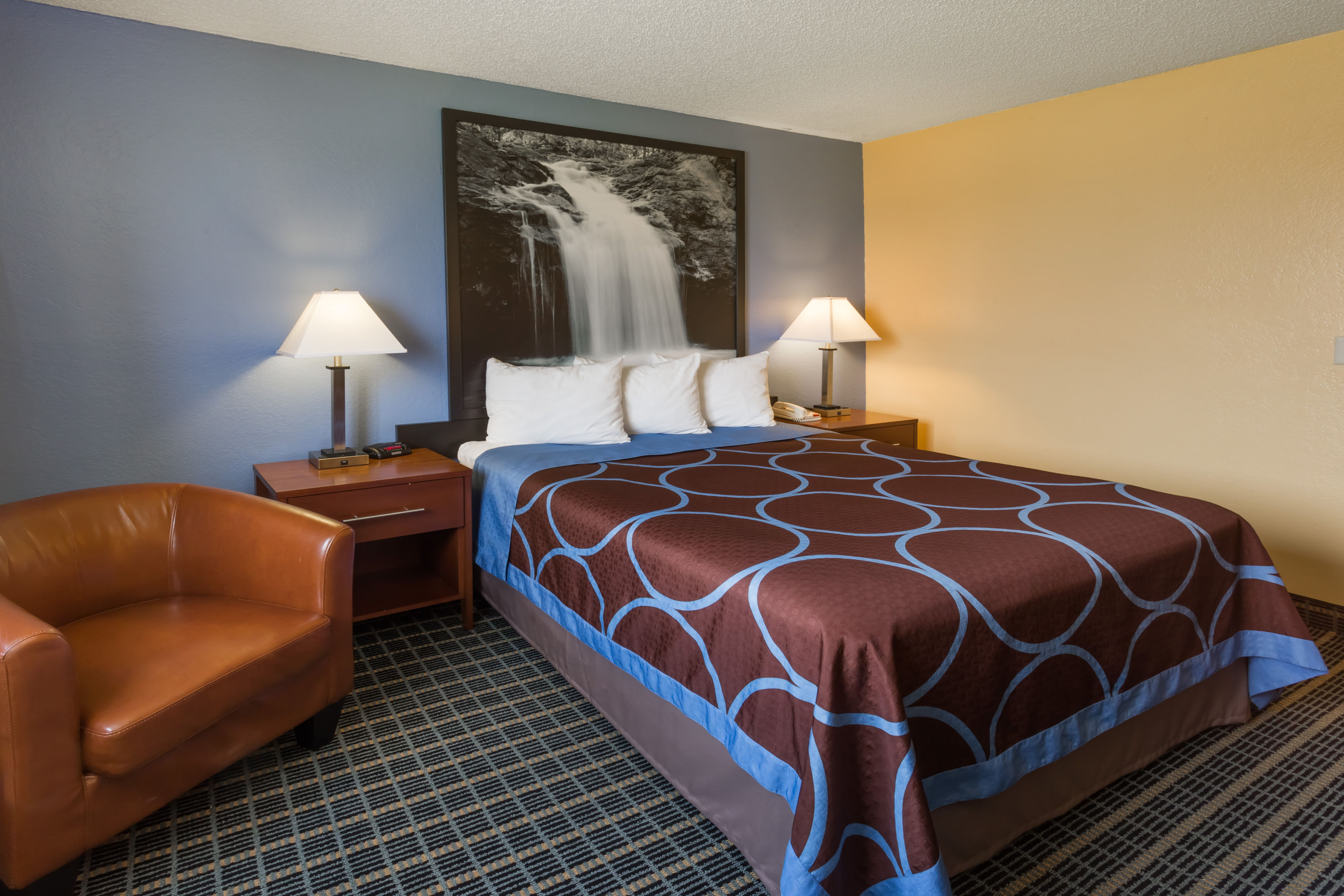 Guest room at the Super 8 by Wyndham Janesville in Janesville, Wisconsin